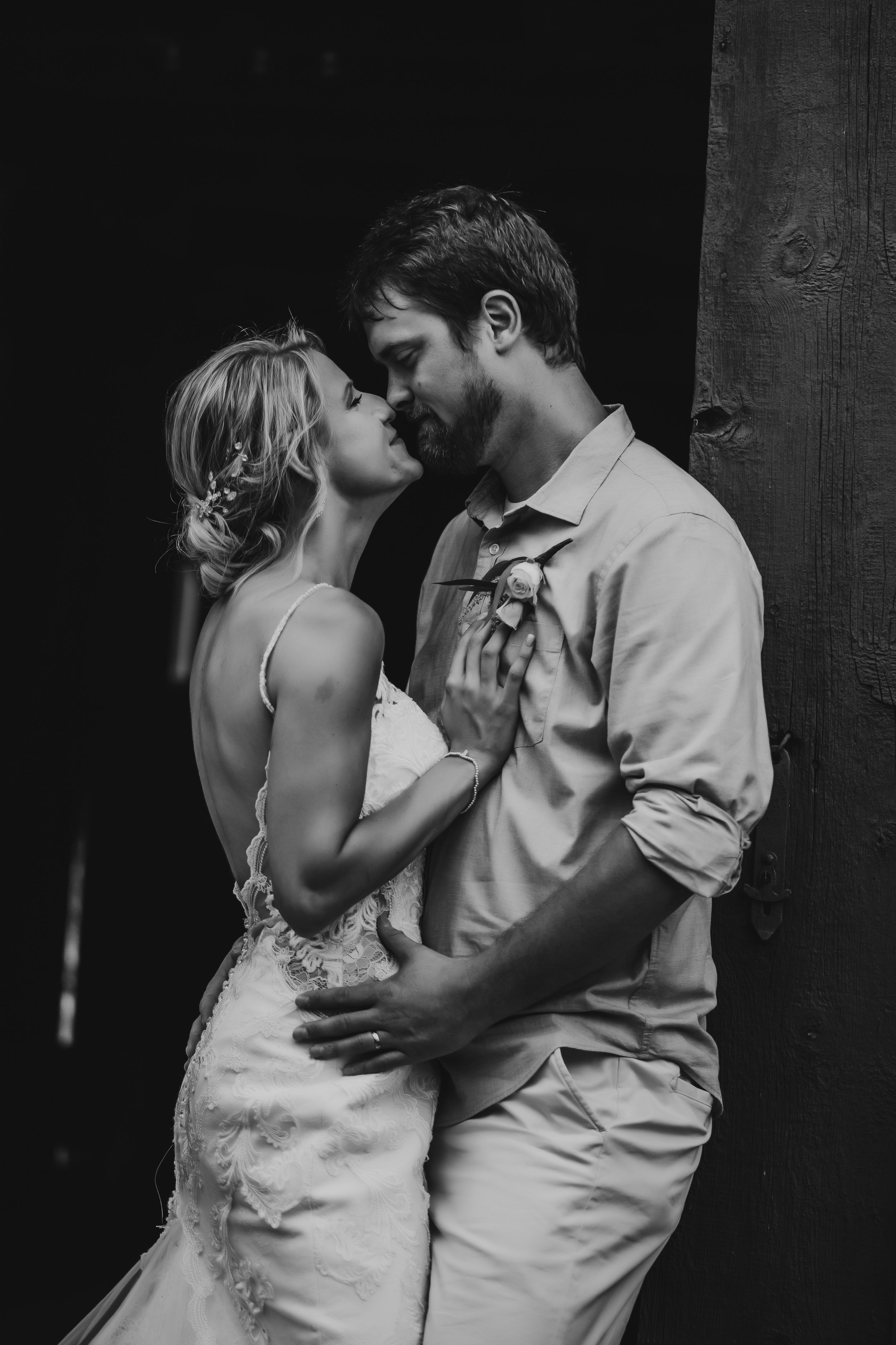  Husband and wife pose for newlywed portraits after their intimate wedding ceremony. casual wedding lace dress long train shorts and button up #TealaWardPhotography #illinoisphotographer #princetonillinois #weddingphotographer #intimatewedding 