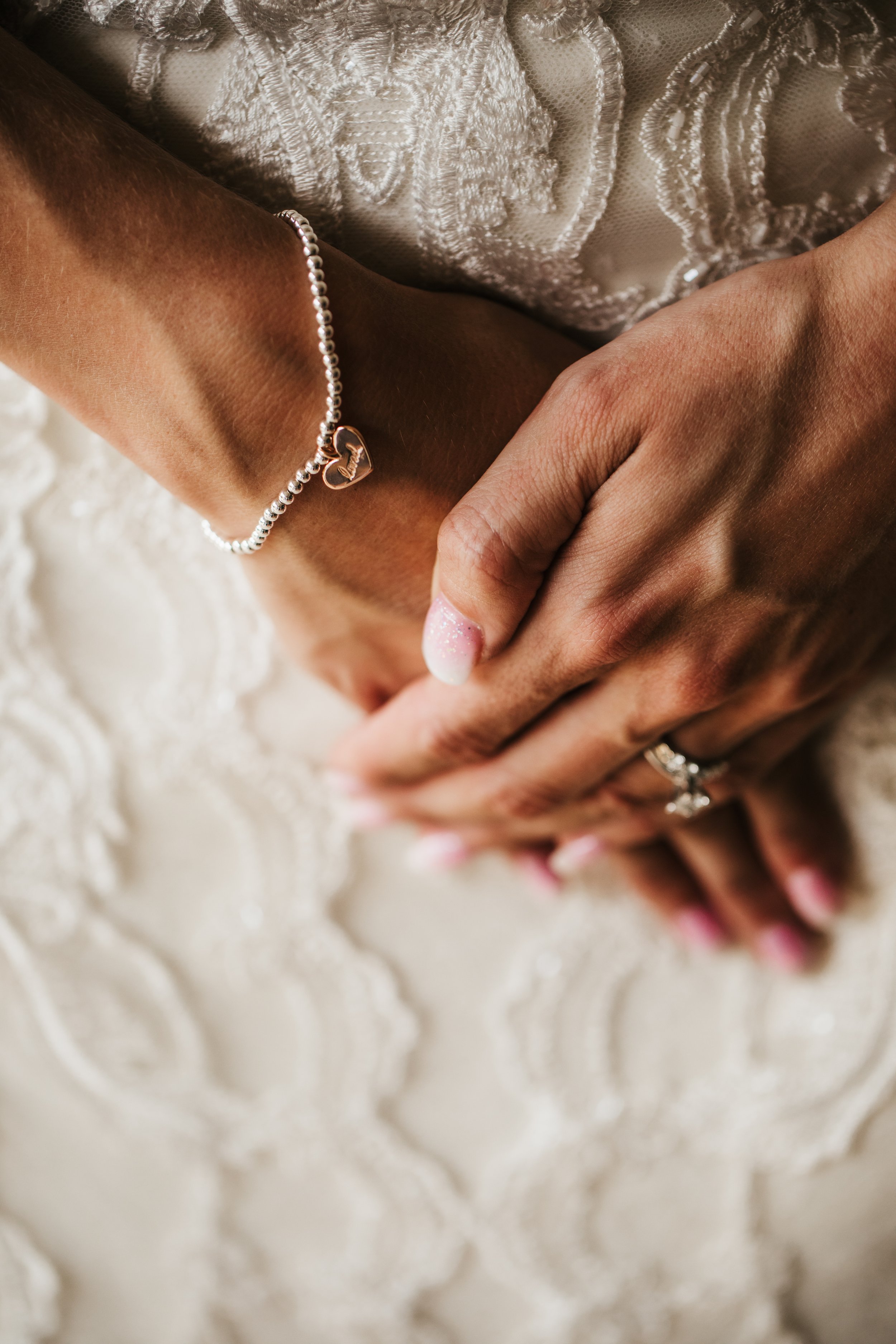  Close up of classic bridal jewelry diamond ring and bracelet lace wedding dress #TealaWardPhotography #illinoisphotographer #princetonillinois #weddingphotographer #intimatewedding 