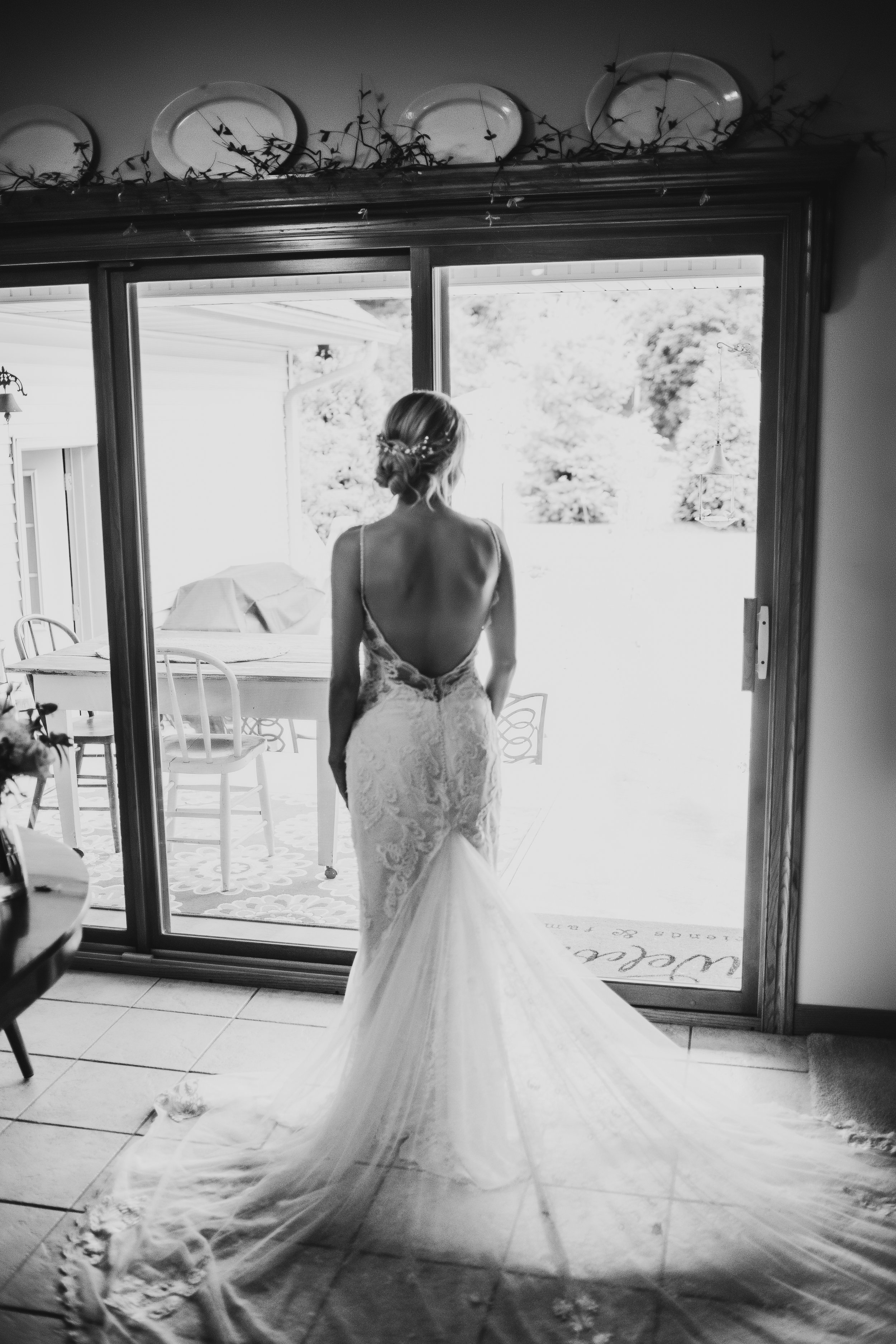  Bridal portrait in front of a window long lace gown bridal train wedding day intimate ceremony at home barn in illinois  #TealaWardPhotography #illinoisphotographer #princetonillinois #weddingphotographer #intimatewedding 