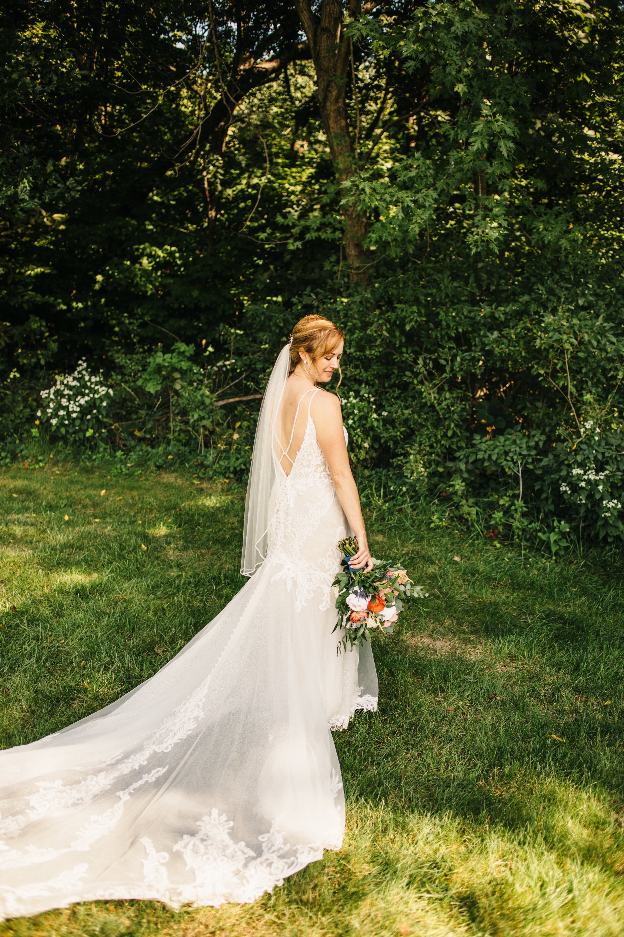  An Illinois Valley late summer wedding with the bride in a green grass field by Teala Ward Photography. summer bridals Illinois Valley #TealaWardPhotography #IllinoisValleyPhotographer #summerwedding #TealaWardWeddings #Illinoisweddings  