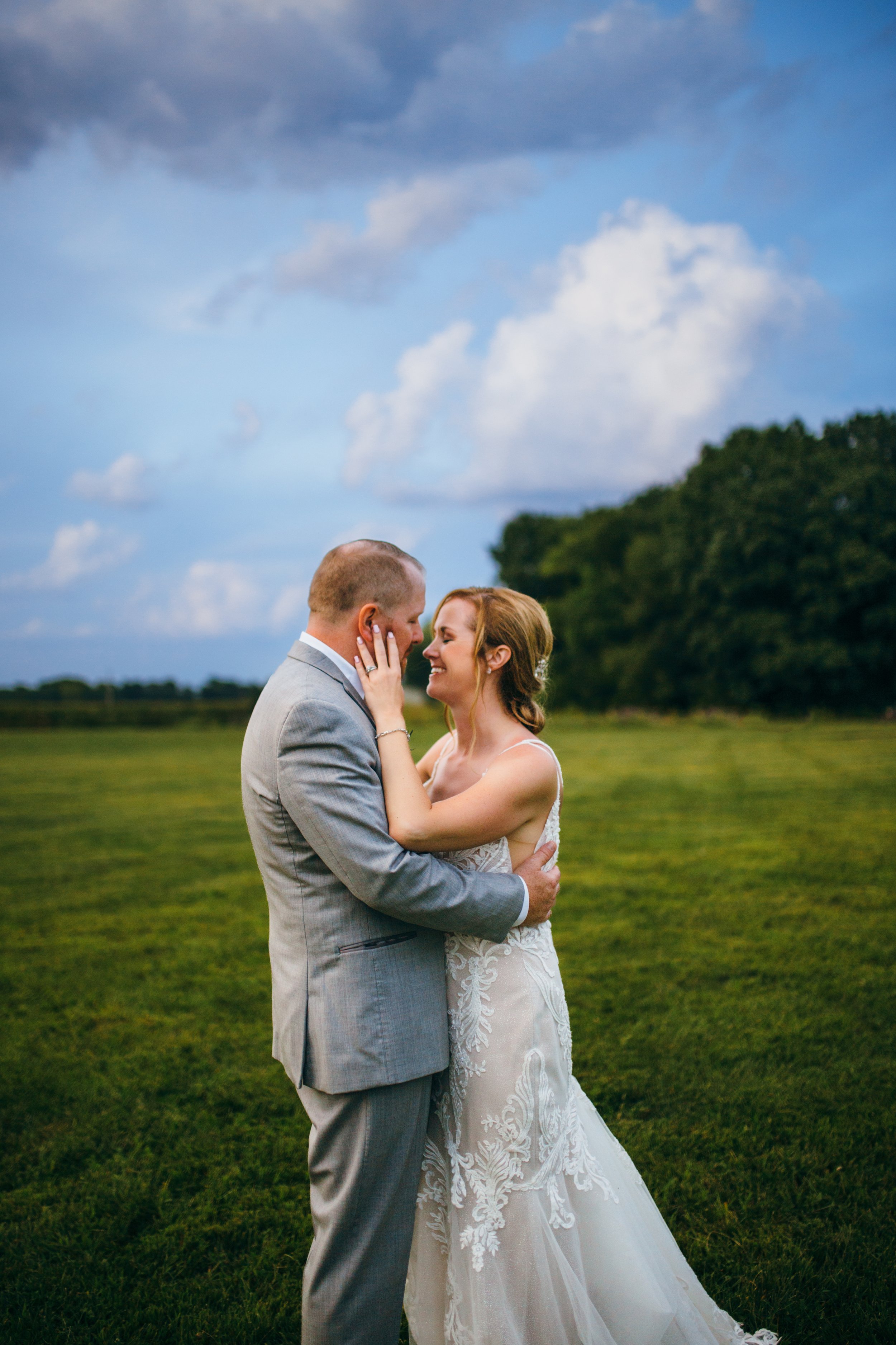  Teala Ward Photography captures a bride and groom with a dramatic Illinois Sky in the background. Blue sky bridals wedding day sky #TealaWardPhotography #IllinoisValleyPhotographer #summerwedding #TealaWardWeddings #Illinoisweddings  