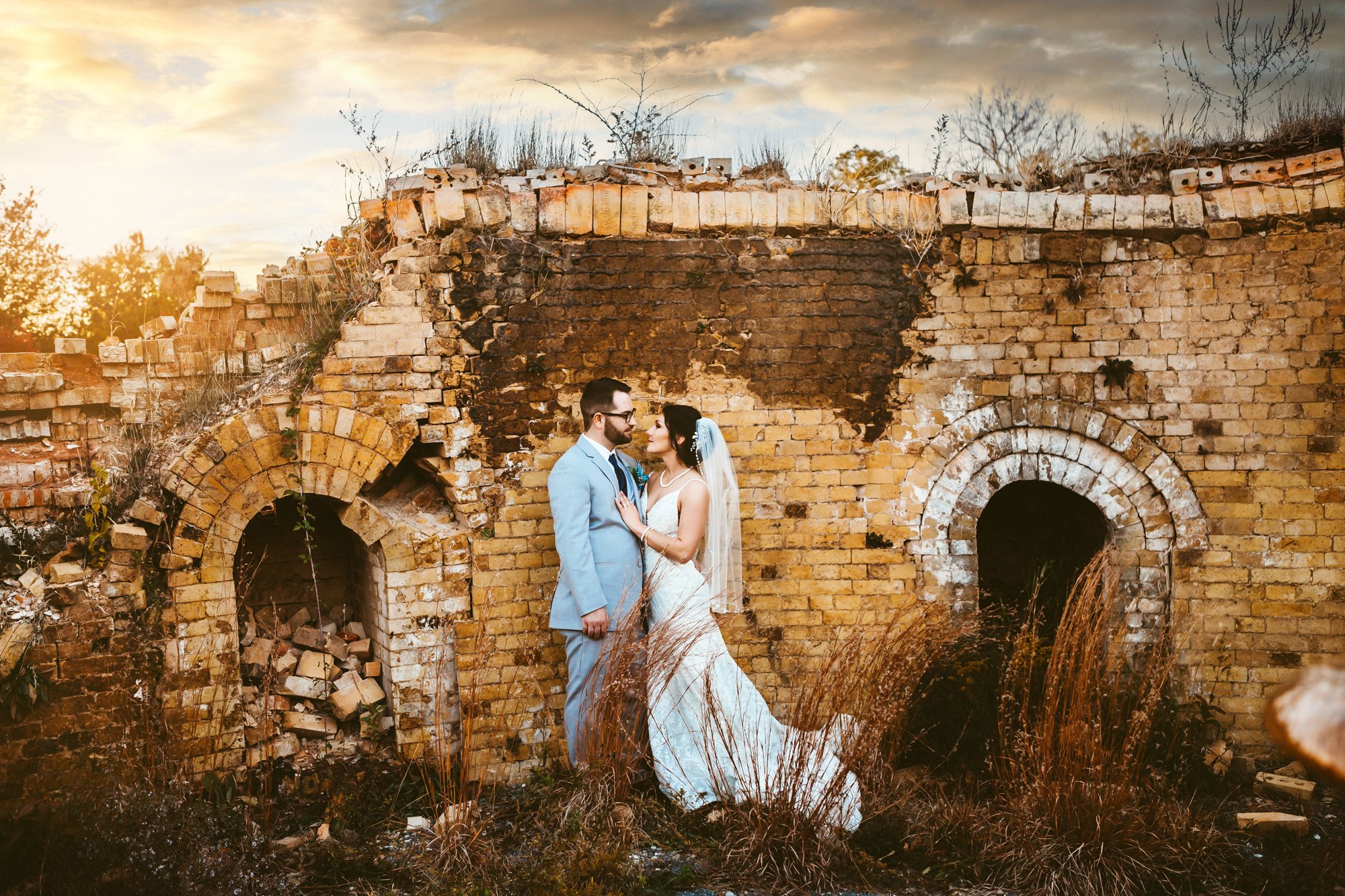  Bride and groom at run-down building by Teala Ward Photography in the Illinois Valley. Moody Bridal Portraits #TealaWardPhotography #TealaWardWeddings #WeddingLocationsIllinois #IllinoisWedding #weddingdetails #weddingphotography #married 