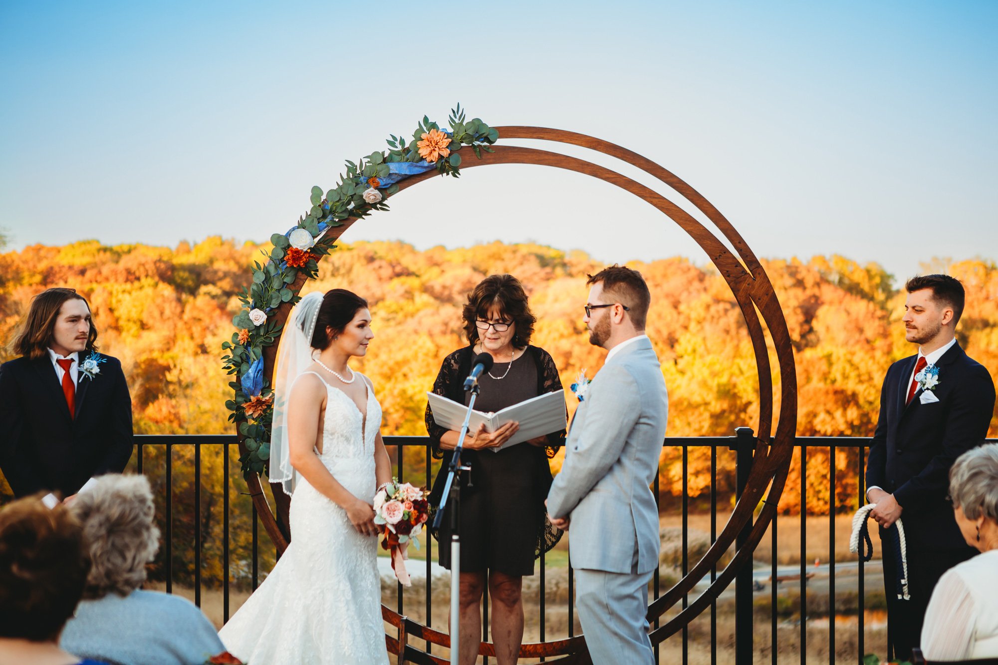  Beautiful fall wedding with colorful leaves behind the wedding altar by Teala Ward Photography. fall leaf weddings #TealaWardPhotography #TealaWardWeddings #WeddingLocationsIllinois #IllinoisWedding #weddingdetails #weddingphotography #married 