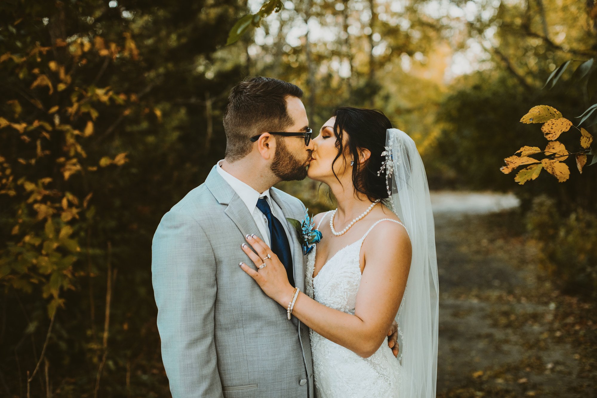  The perfect fall wedding in the Illinois Valley for a bride and groom with leaves and a pond by Teala Ward Photography. #TealaWardPhotography #TealaWardWeddings #WeddingLocationsIllinois #IllinoisWedding #weddingdetails #weddingphotography #married 