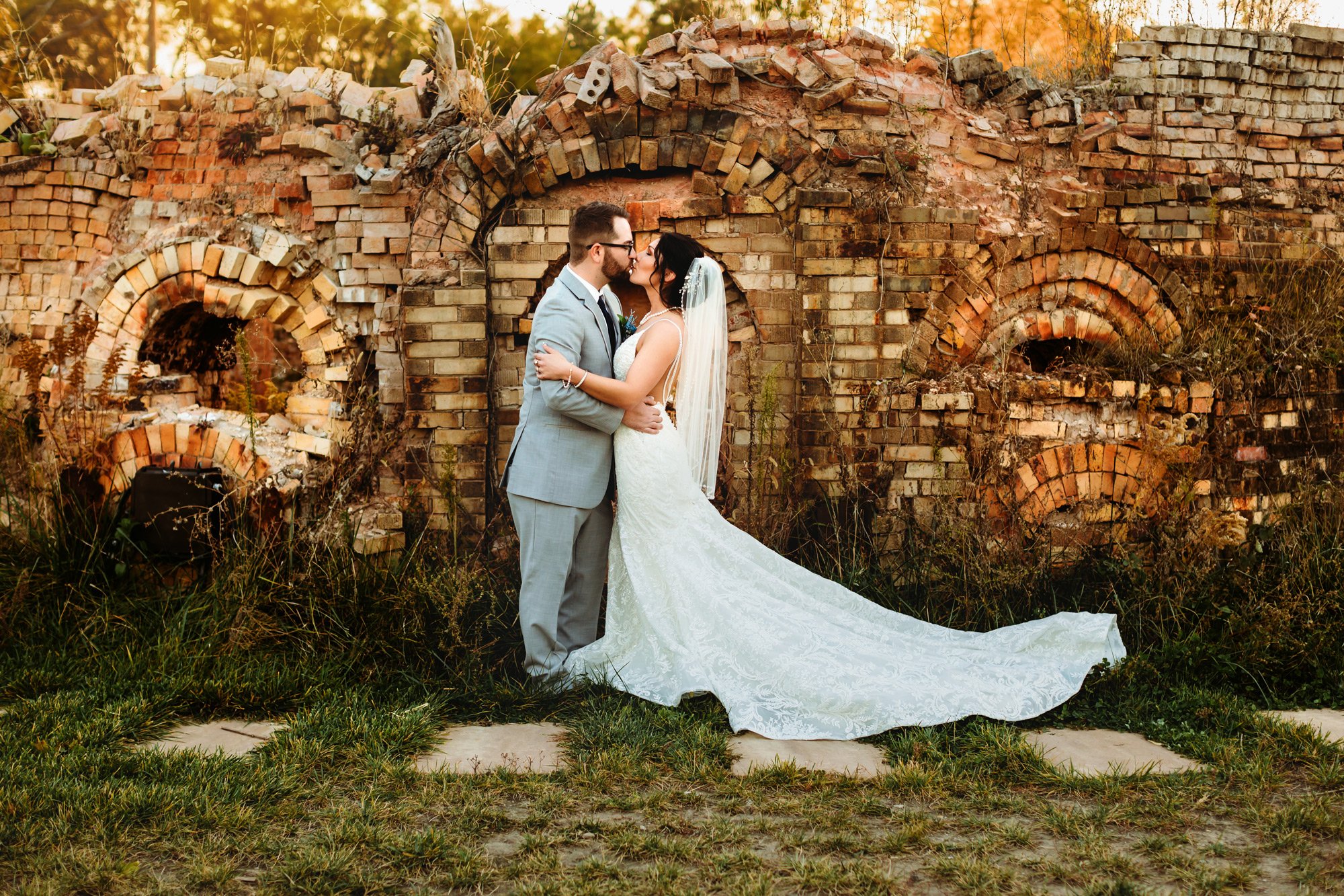  In a romantic location the bride and groom kiss with a moody edit by Teala Ward Photography. wedding inspo fall #TealaWardPhotography #TealaWardWeddings #WeddingLocationsIllinois #IllinoisWedding #weddingdetails #weddingphotography #married 