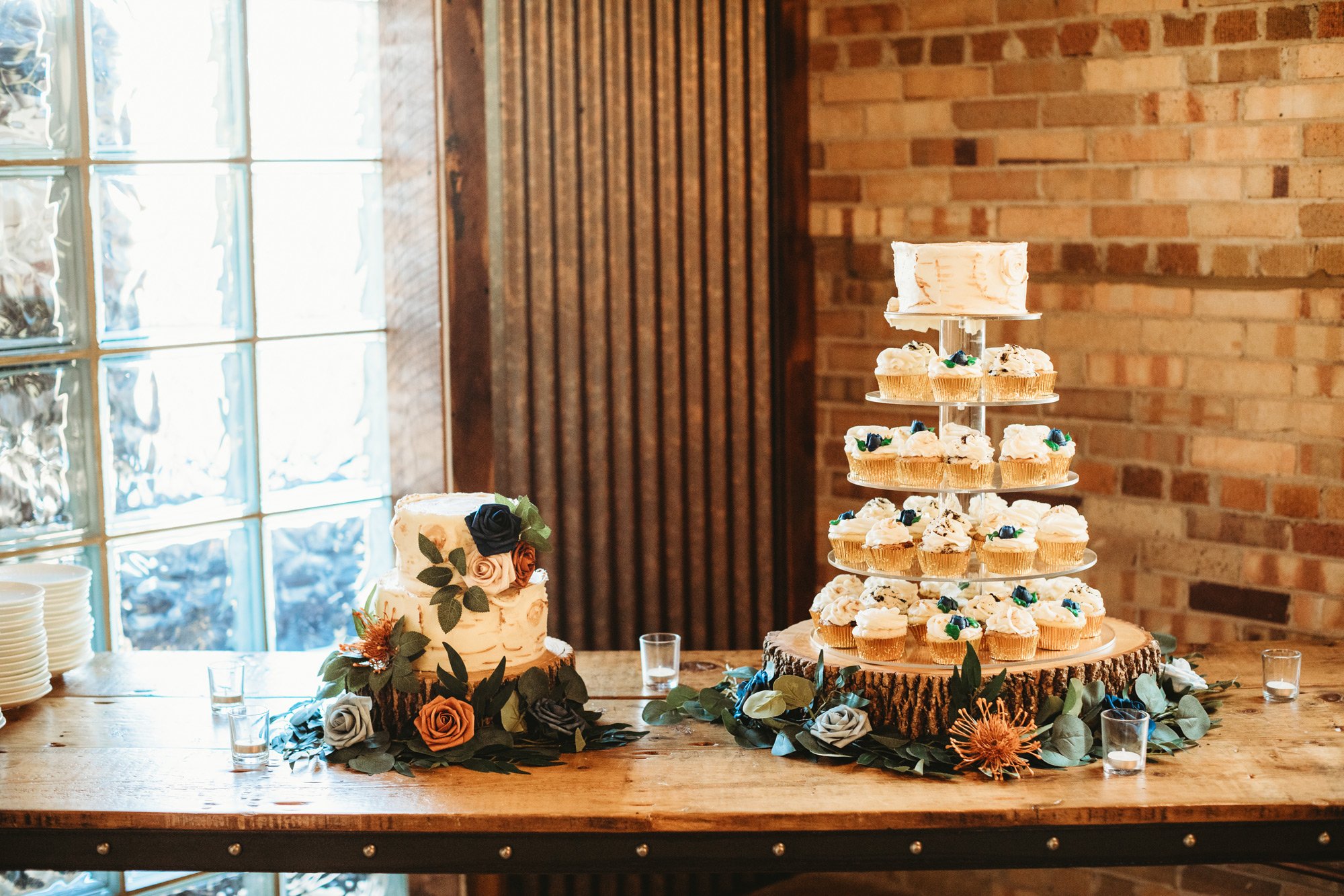  Rustic wedding cake with a cupcake display next to it for guests captured by Teala Ward Photography. wedding cake cupcake #TealaWardPhotography #TealaWardWeddings #WeddingLocationsIllinois #IllinoisWedding #weddingdetails #weddingphotography #marrie