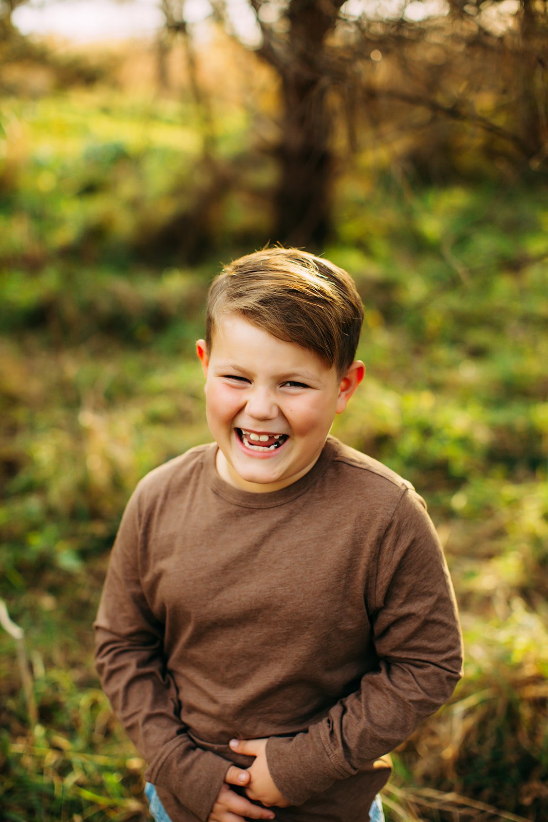  A professional family photographer captures a portrait of a laughing boy by Teala Ward Photography. laughing portrait #TealaWardPhotography #TealaWardFamilies #holidayfamilypics #photography #Illinoisfamilyphotography #familysession 