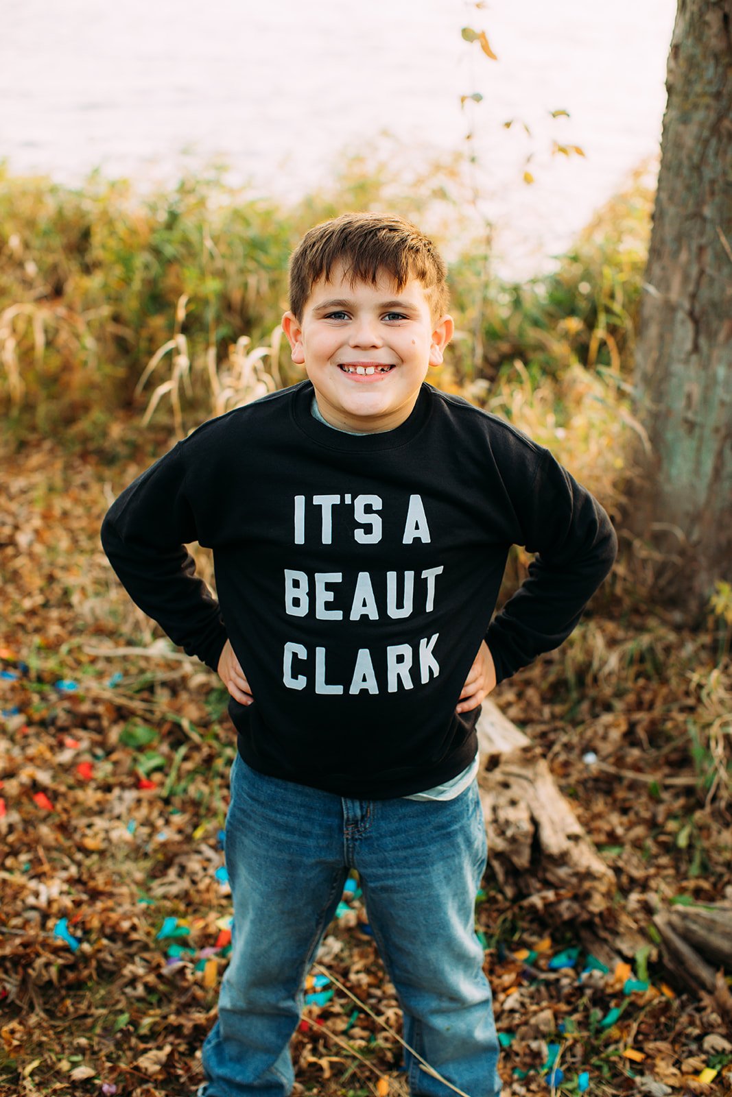  Christmas-themed family portraits with a boy wearing an "It's a Beaut Clark" sweater by Teala Ward Photography. funny Xmas portraits #TealaWardPhotography #TealaWardFamilies #holidayfamilypics #photography #Illinoisfamilyphotography #familysession 