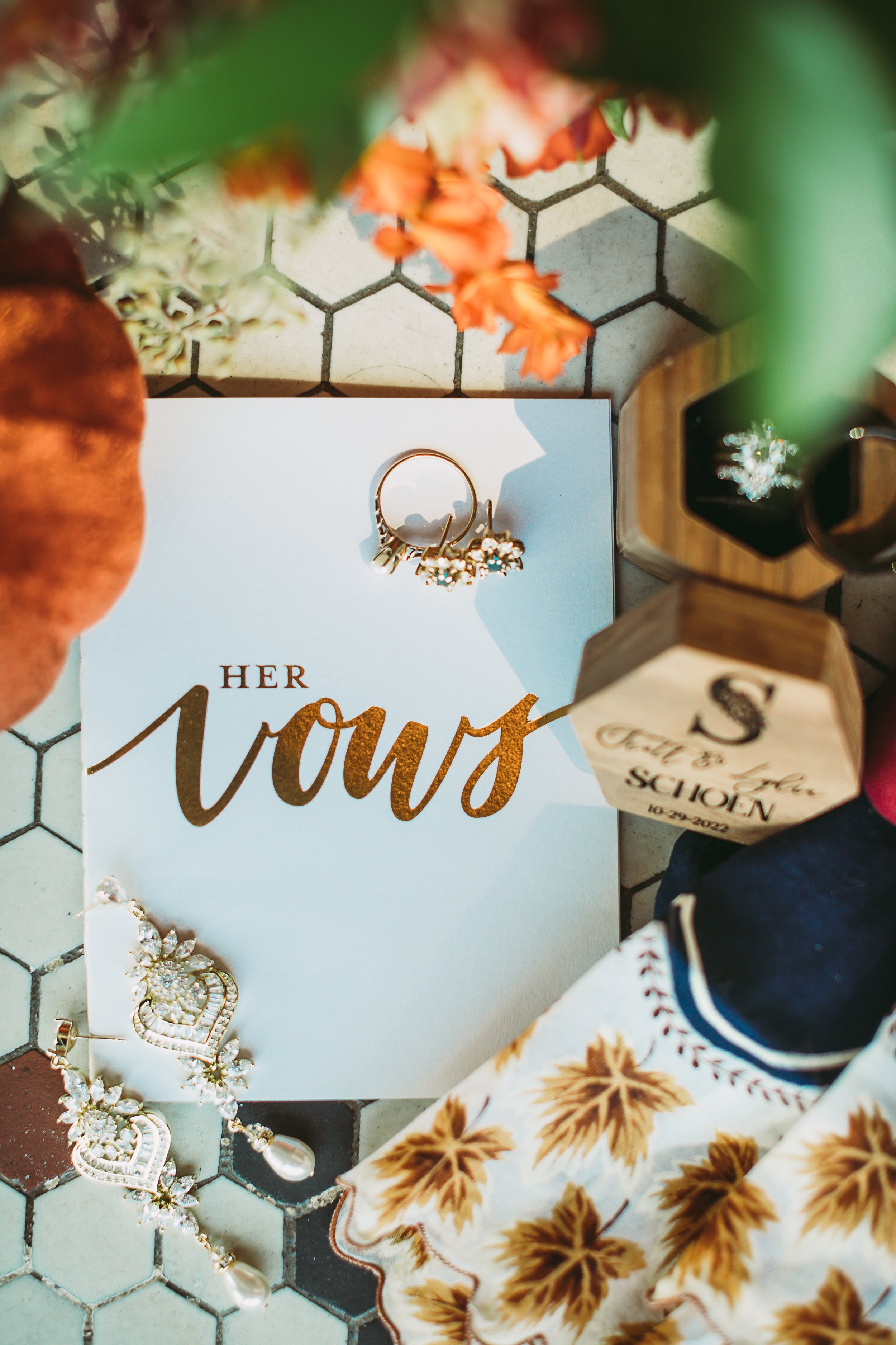  Flat lay of wedding vow cards, wedding jewelry, and florals by Teala Ward Photography in Illinois. vow flat lay #TealaWardPhotography #TealaWardWeddings #Illinoisweddingphotographer #weddingphotographer #weddings #ILweddings #weddingday 