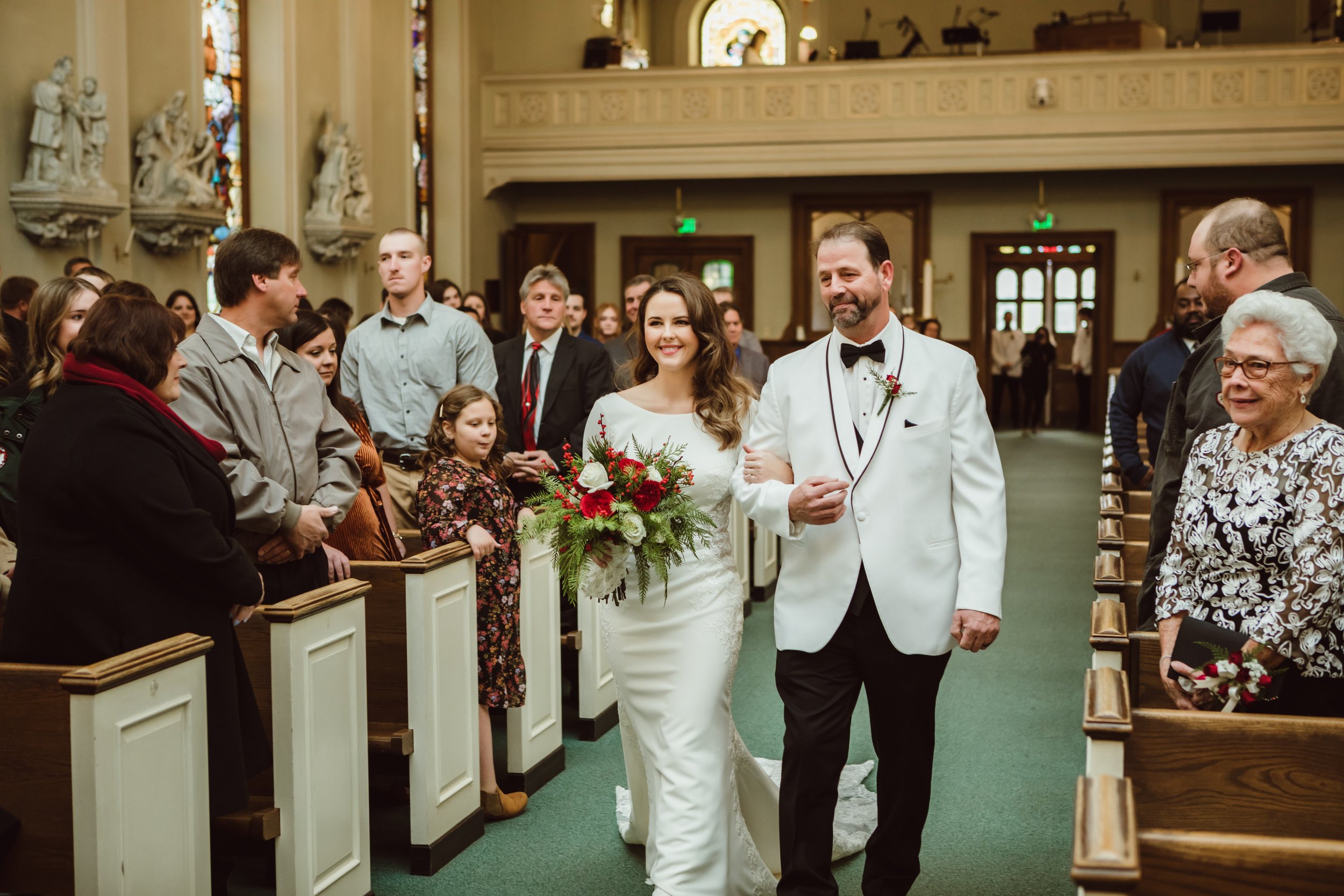 Bride walks down the aisle with her father at a historic building in LaSalle by Teala Ward Photography. walk down the aisle #TealaWardPhotography #TealaWardWeddings #LaSalleWedding #churchwedding #Illinoisweddingphotographer #LaSalle,IL 