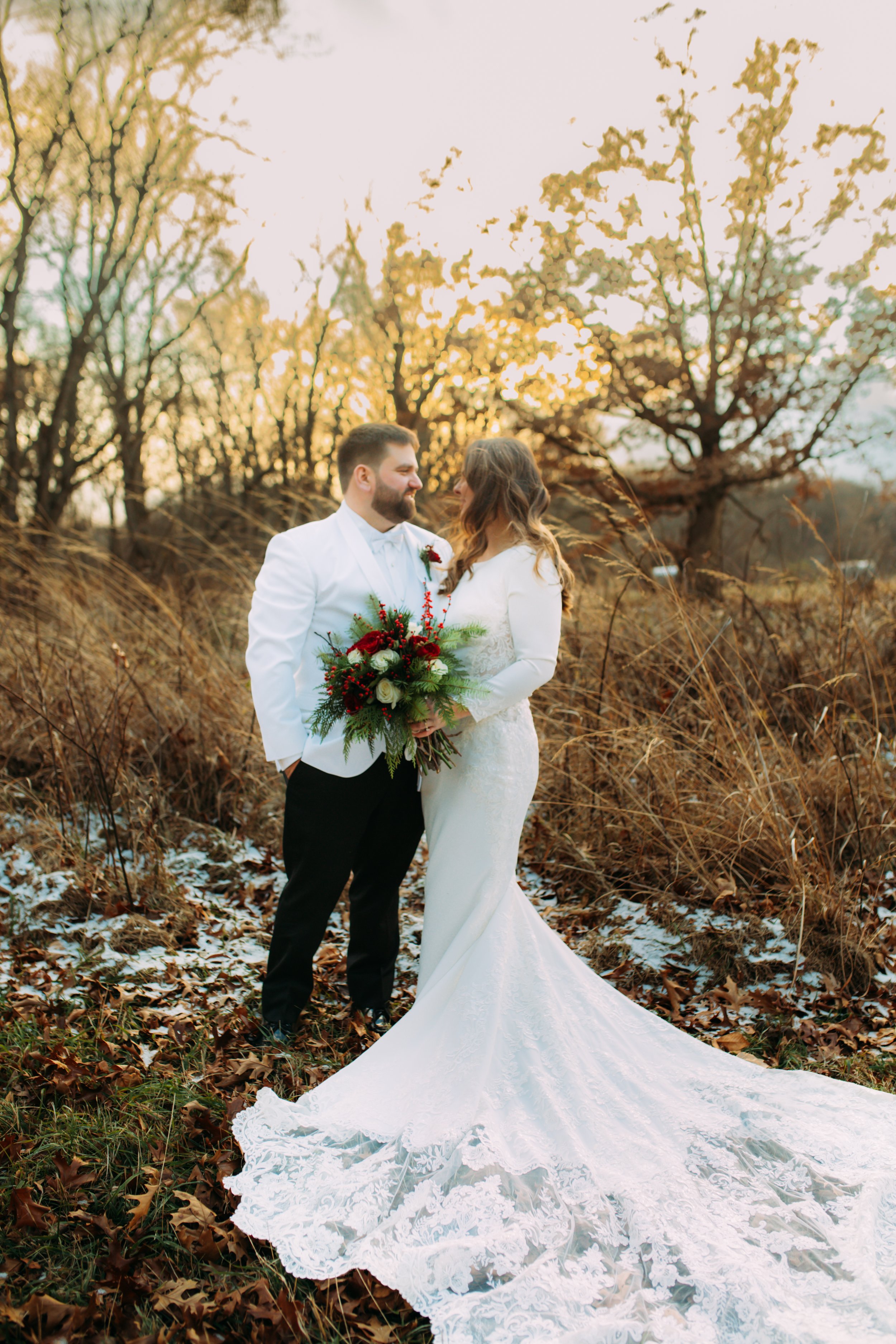  Bride and groom outside as the sun is setting in the winter by Teala Ward Photography IL wedding photographer. bride and groom #TealaWardPhotography #TealaWardWeddings #LaSalleWedding #churchwedding #Illinoisweddingphotographer #LaSalle,IL 