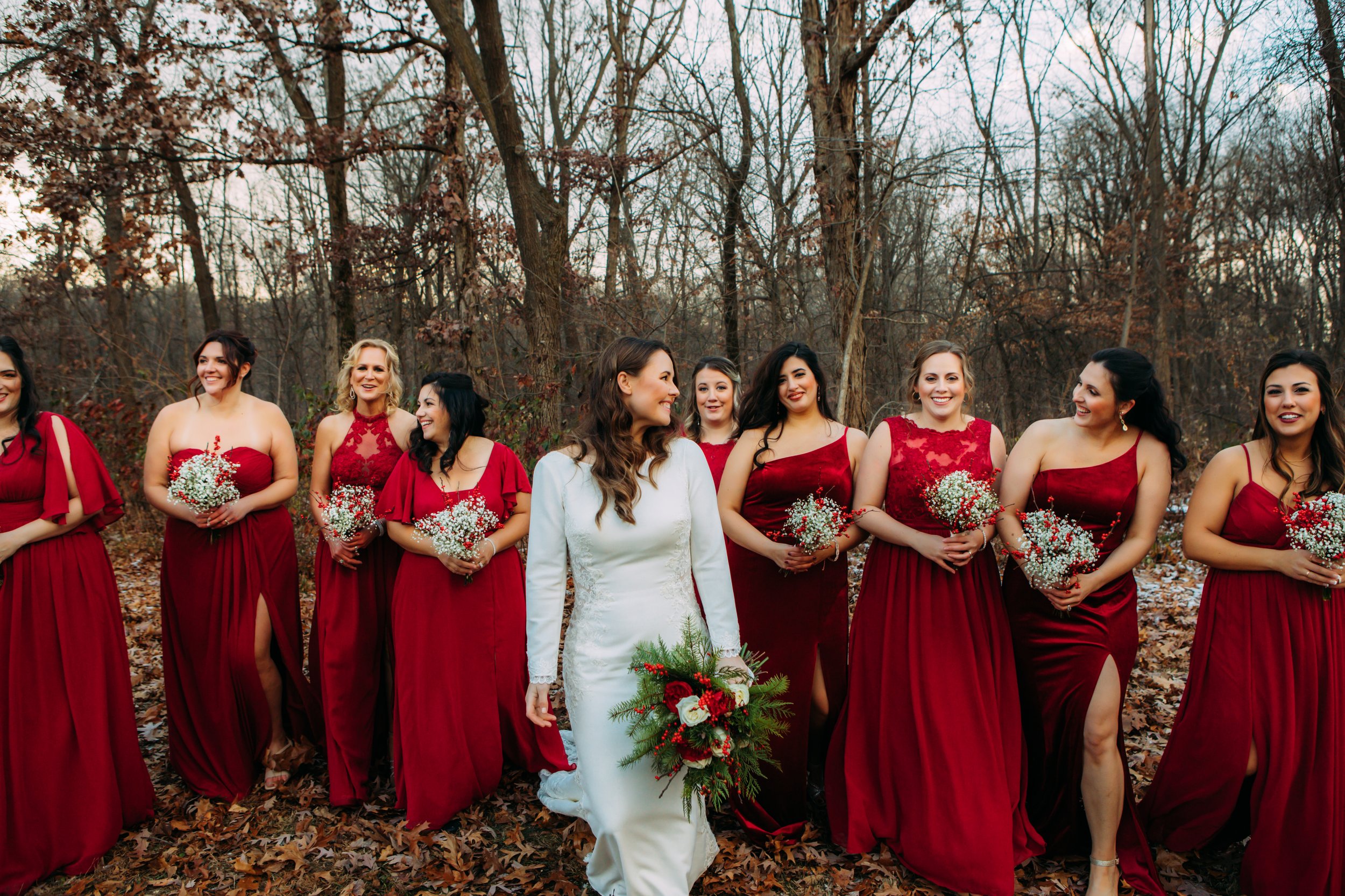  Teala Ward Photography captures the bridesmaids laughing in their red gowns with the bride. red bridesmaid dress #TealaWardPhotography #TealaWardWeddings #LaSalleWedding #churchwedding #Illinoisweddingphotographer #LaSalle,IL 