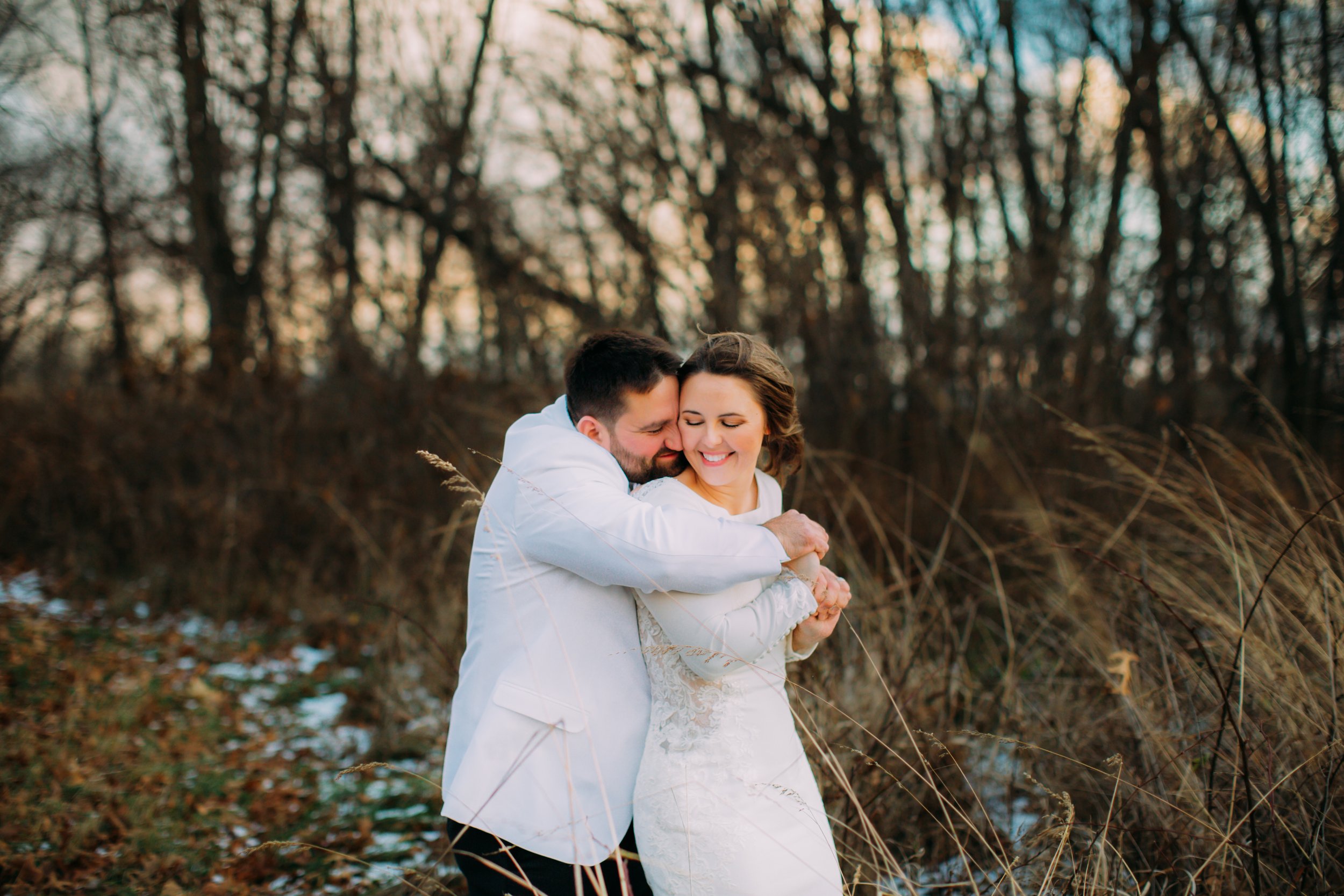  Teala Ward Photography captures a groom hugging his bride on their wedding day in LaSalle, IL in the cold weather. cold weather wedding #TealaWardPhotography #TealaWardWeddings #LaSalleWedding #churchwedding #Illinoisweddingphotographer #LaSalle,IL 