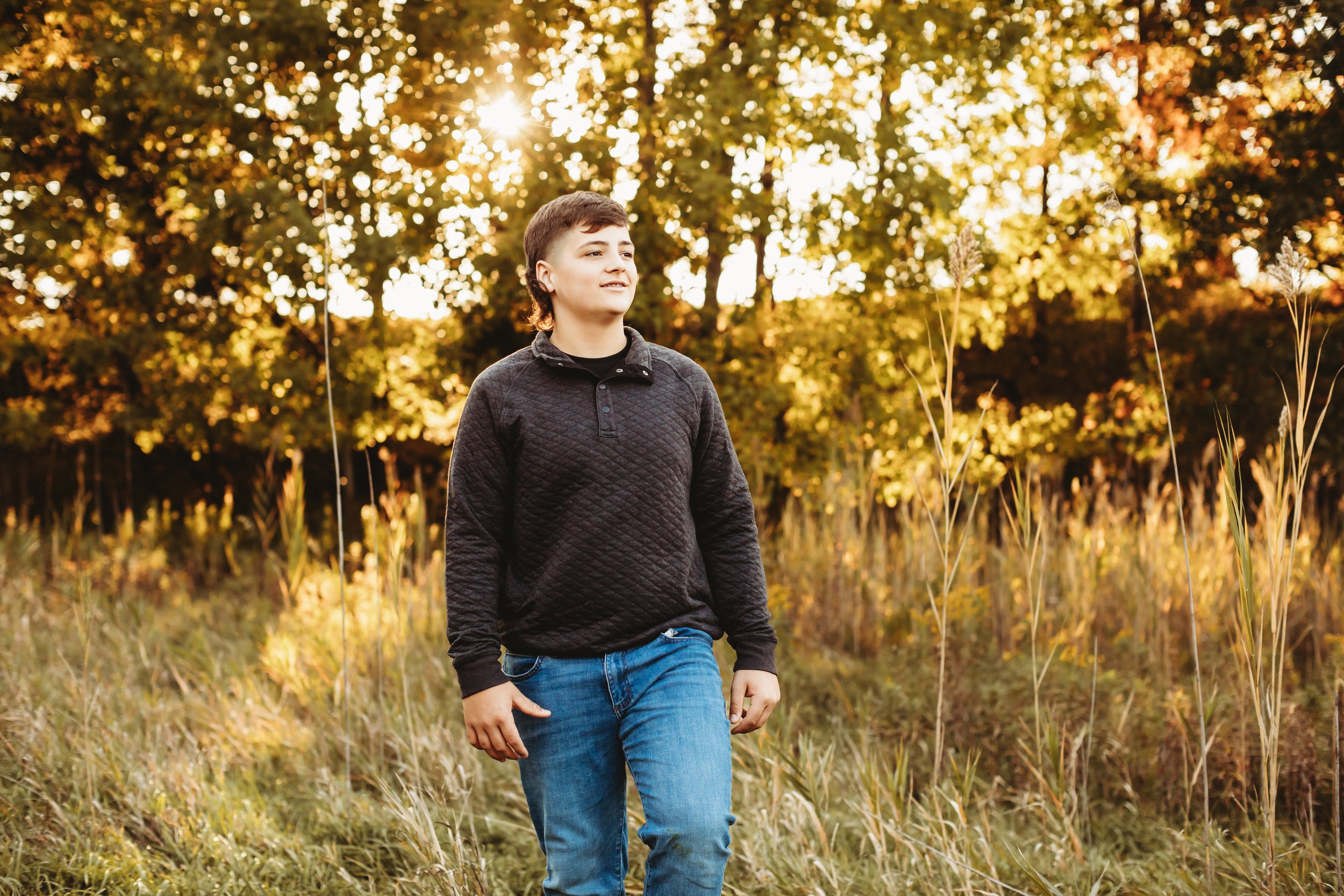  Teala Ward Photography captures a portrait of a teenage boy in Buffalo Rock, Illinois. black shirt for boy setting sun yellow grass field older son style #TealaWardPhotography #TealaWardFamilies #Outdoorfamilyportraits #IllinoisPhotographer #ILFamil