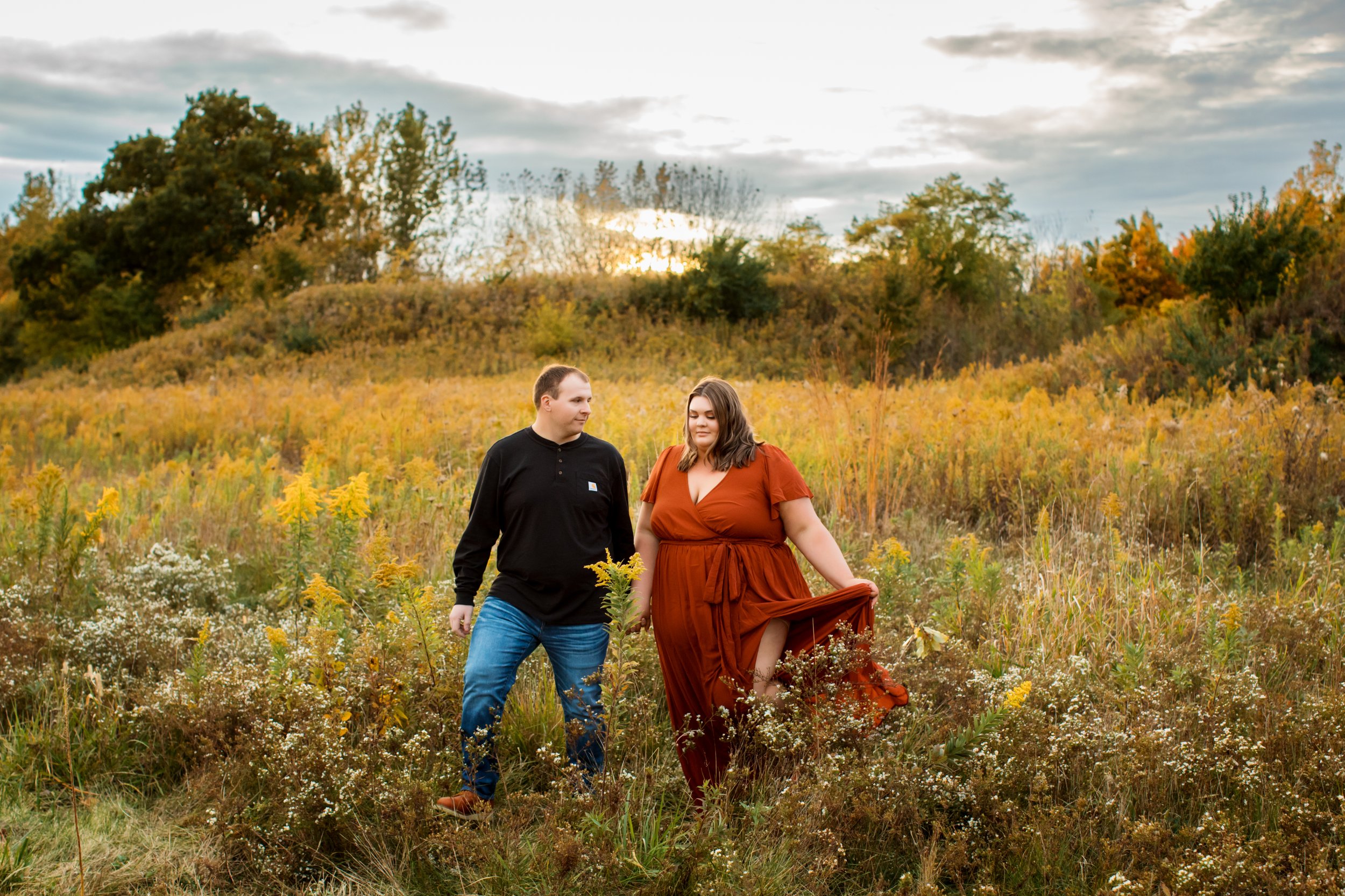  A captivating portrait of an engaged couple walking through a wildflower field in the Illinois Valley by Teala Ward Photography. wildflower engagement portraits #TealaWardPhotography #TealaWardEngagements #Weddingphotographer #ILweddings #Weddingeng