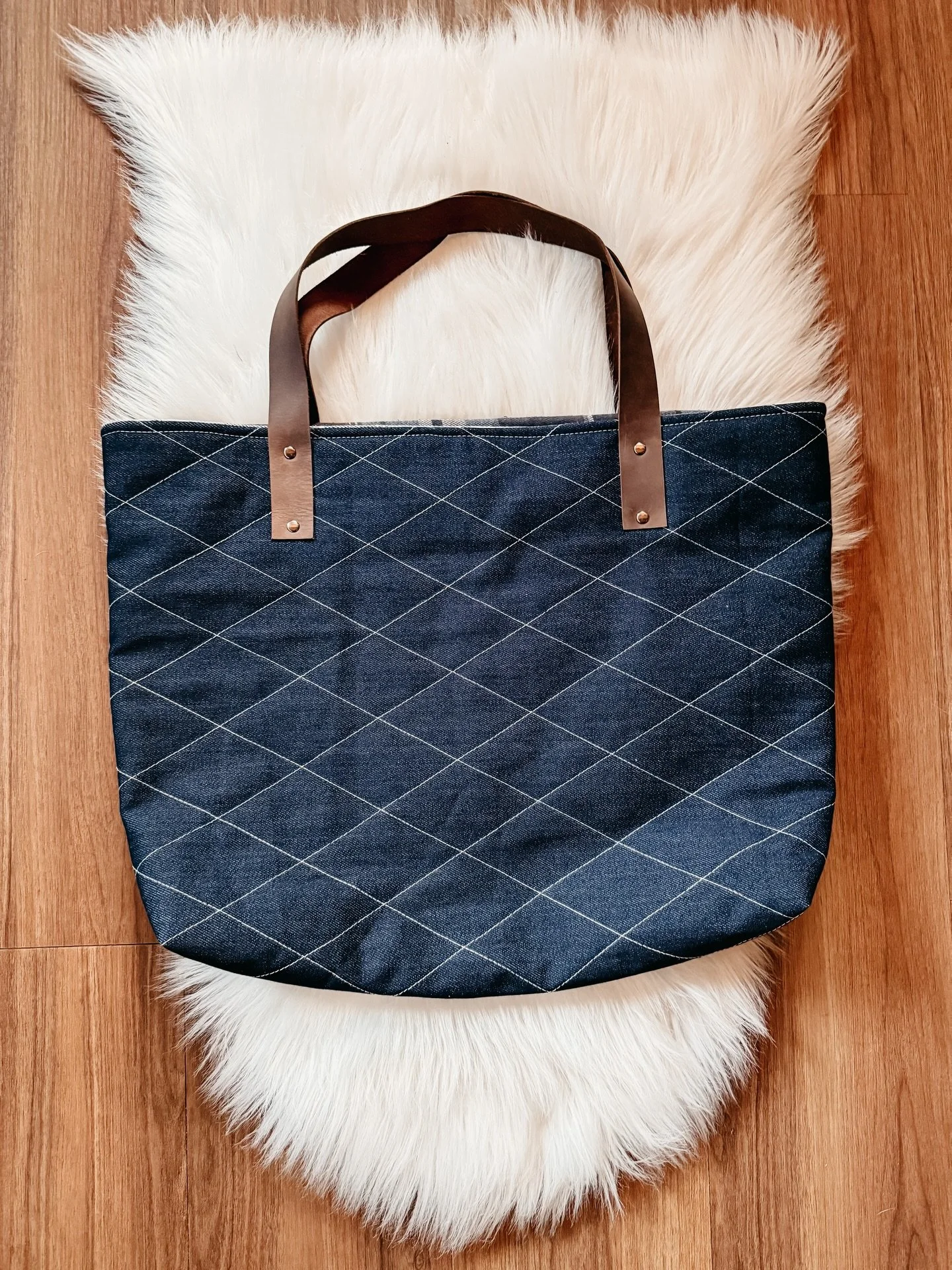 The Midnight Denim Tote is officially here ✨

A sturdy, everyday tote designed for everyday use &mdash; sturdy, functional, and meant to hold up.

This pattern features double cap rivets, leather straps, and a new turn-bag construction that gives you