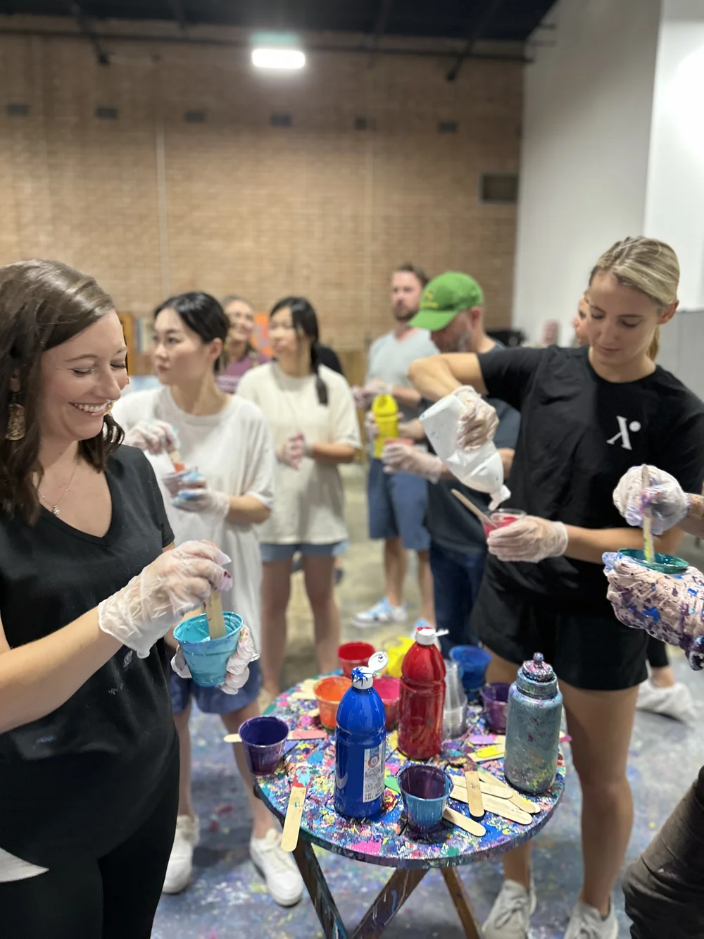 Mixing paint into cups before a session.