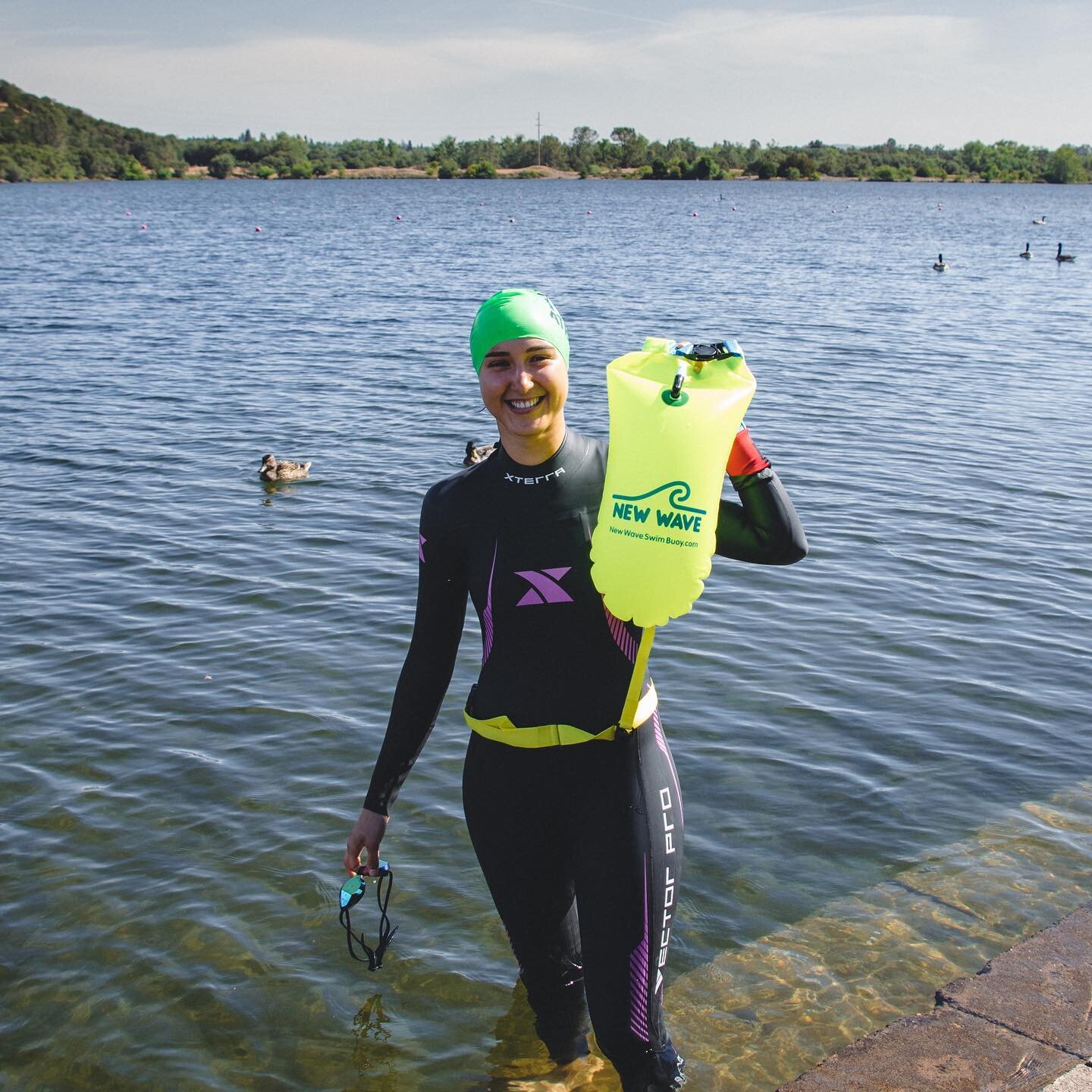 Getting some open water swimming practice in this summer with our #NewWaveSwimBuoy.
