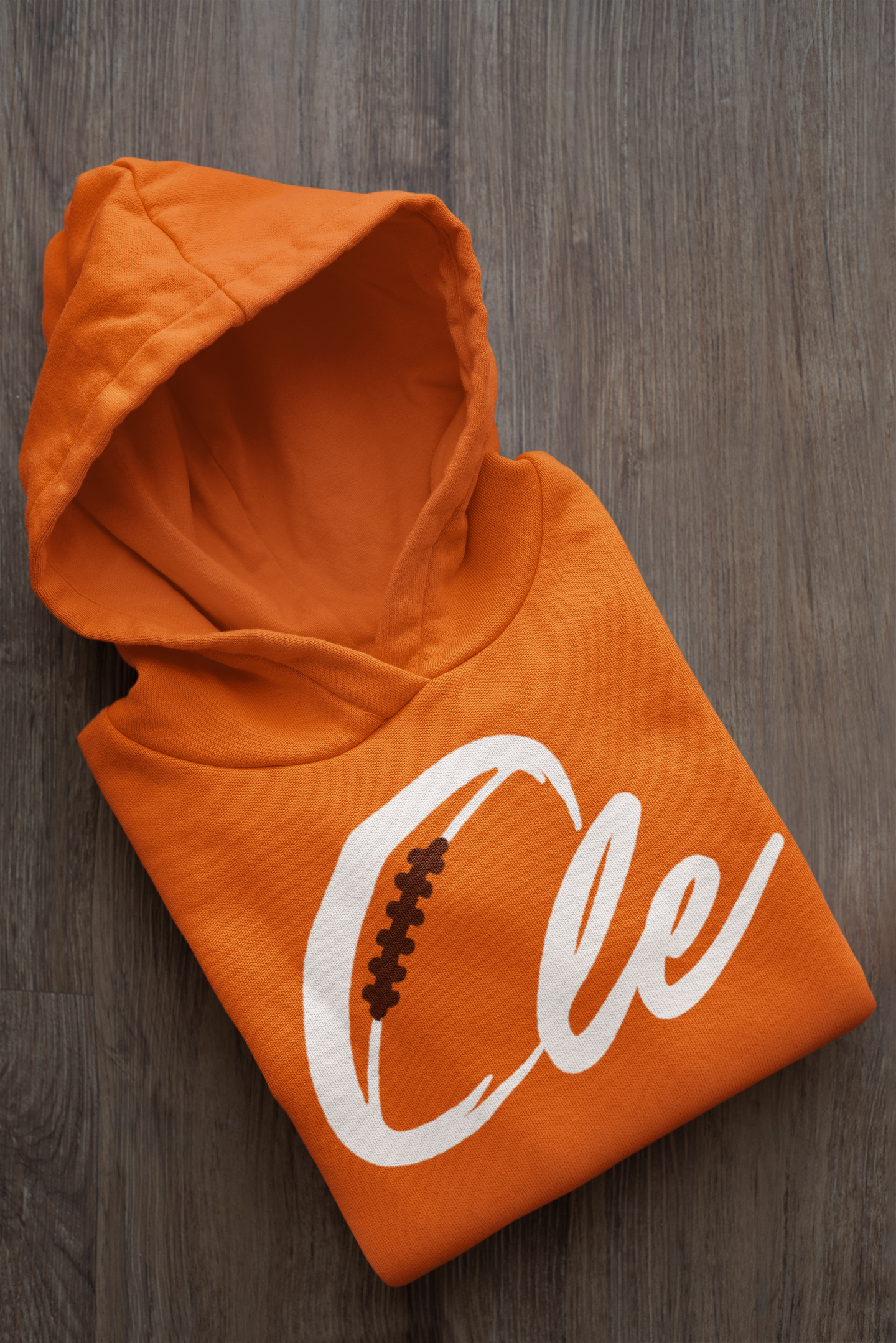 mockup-of-a-folded-customizable-hoodie-placed-on-a-wooden-surface-33874a (2).png