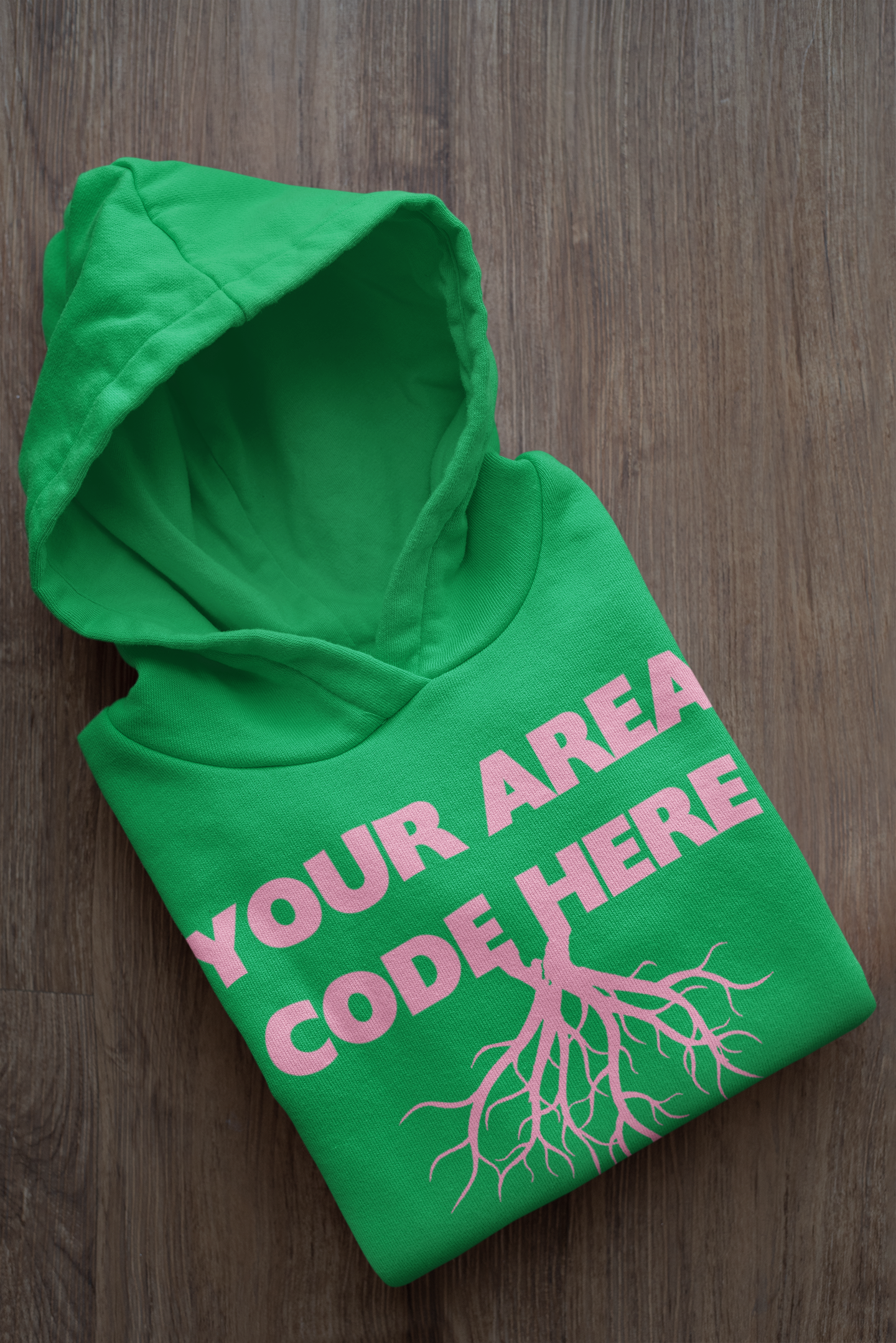 mockup-of-a-folded-customizable-hoodie-placed-on-a-wooden-surface-33874a.png
