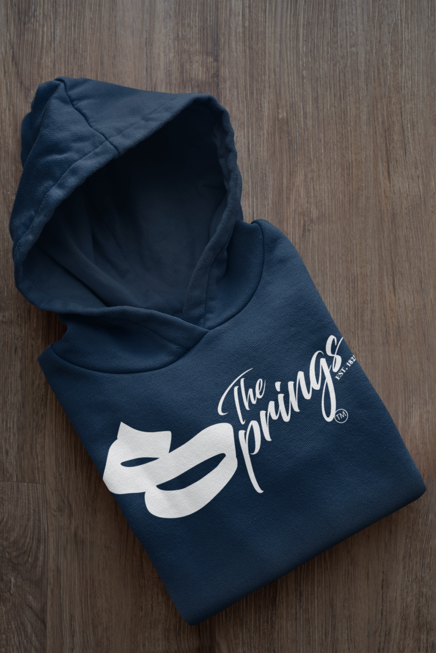 mockup-of-a-folded-customizable-hoodie-placed-on-a-wooden-surface-33874a (11).png