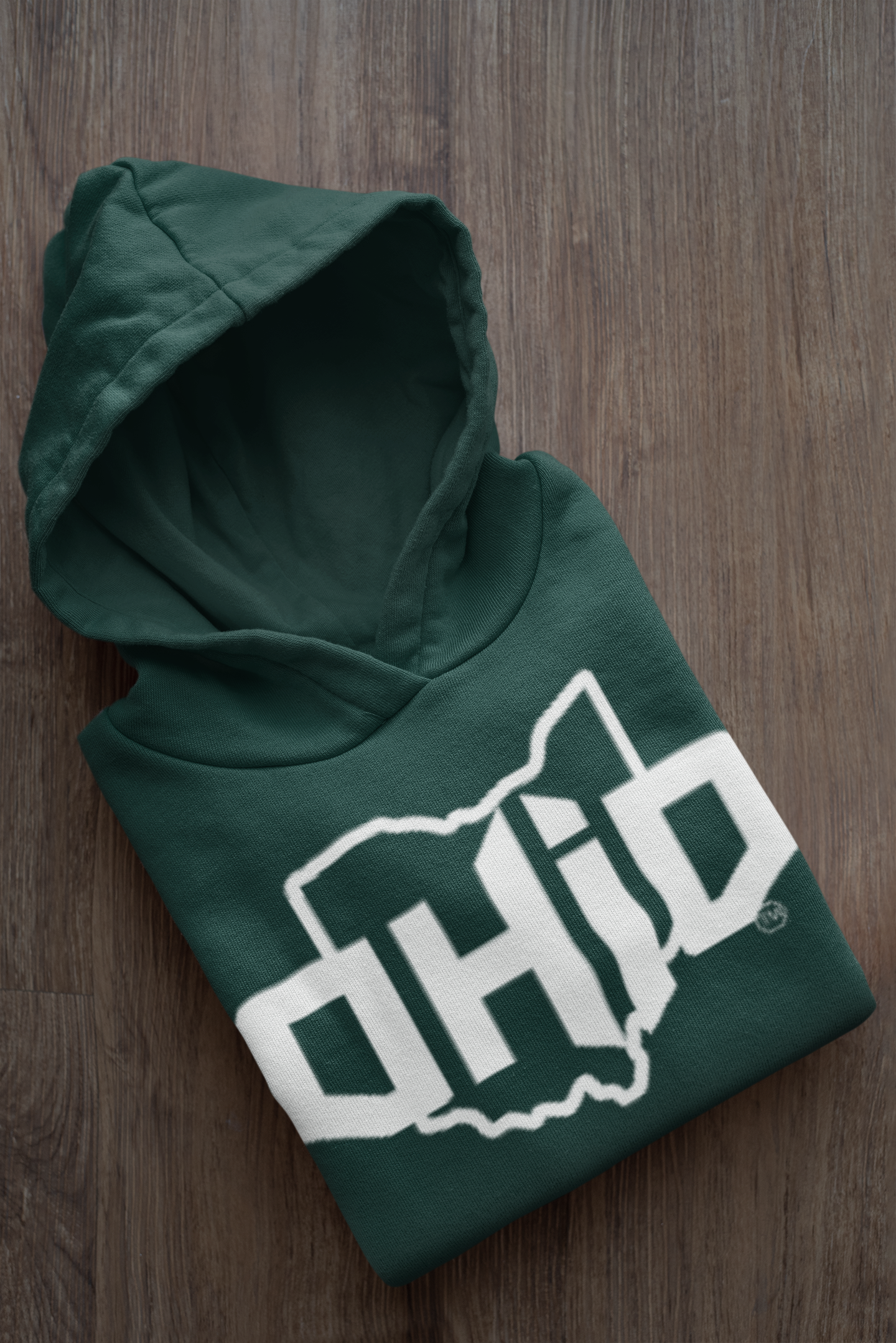 mockup-of-a-folded-customizable-hoodie-placed-on-a-wooden-surface-33874a.png