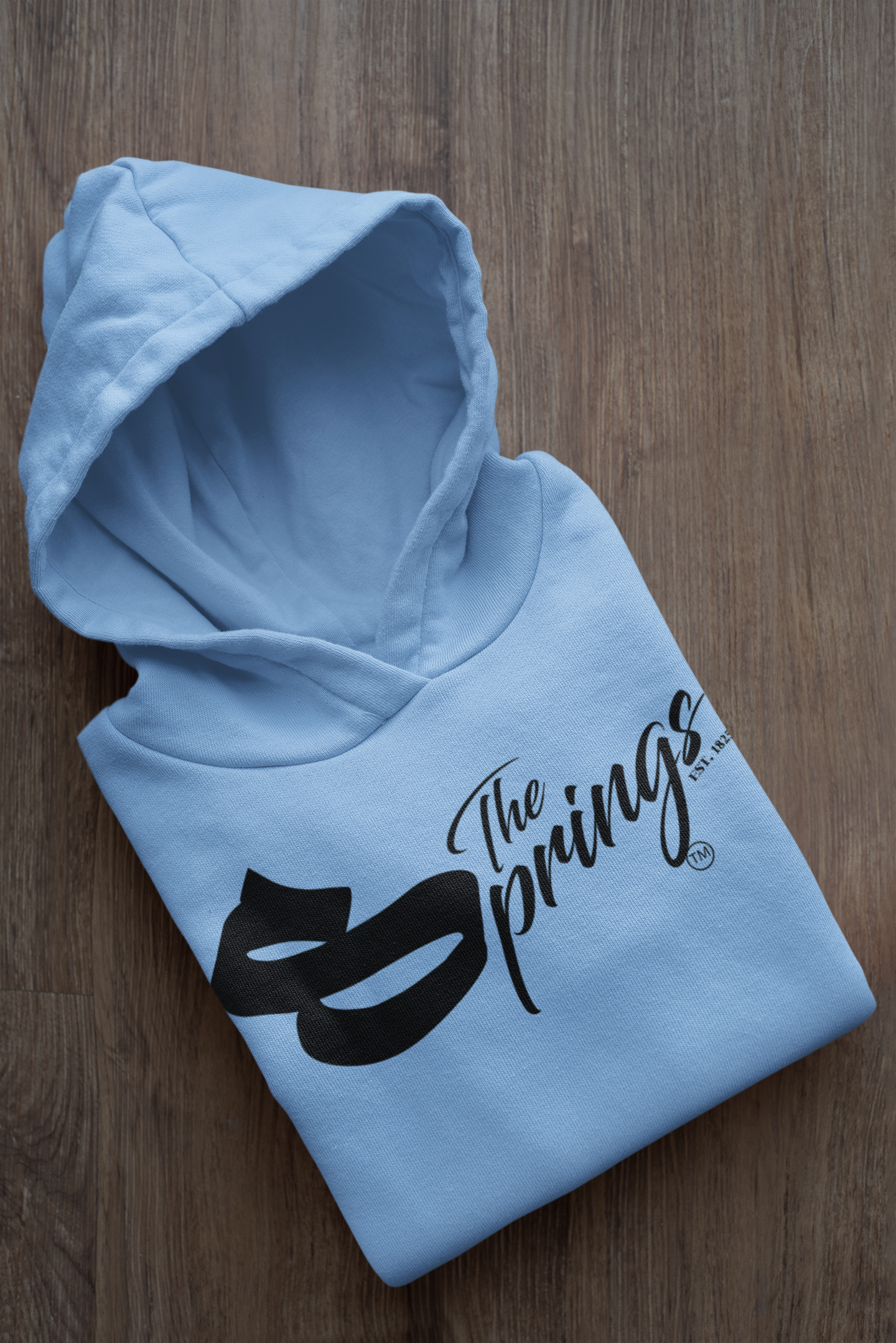 mockup-of-a-folded-customizable-hoodie-placed-on-a-wooden-surface-33874a (5).png