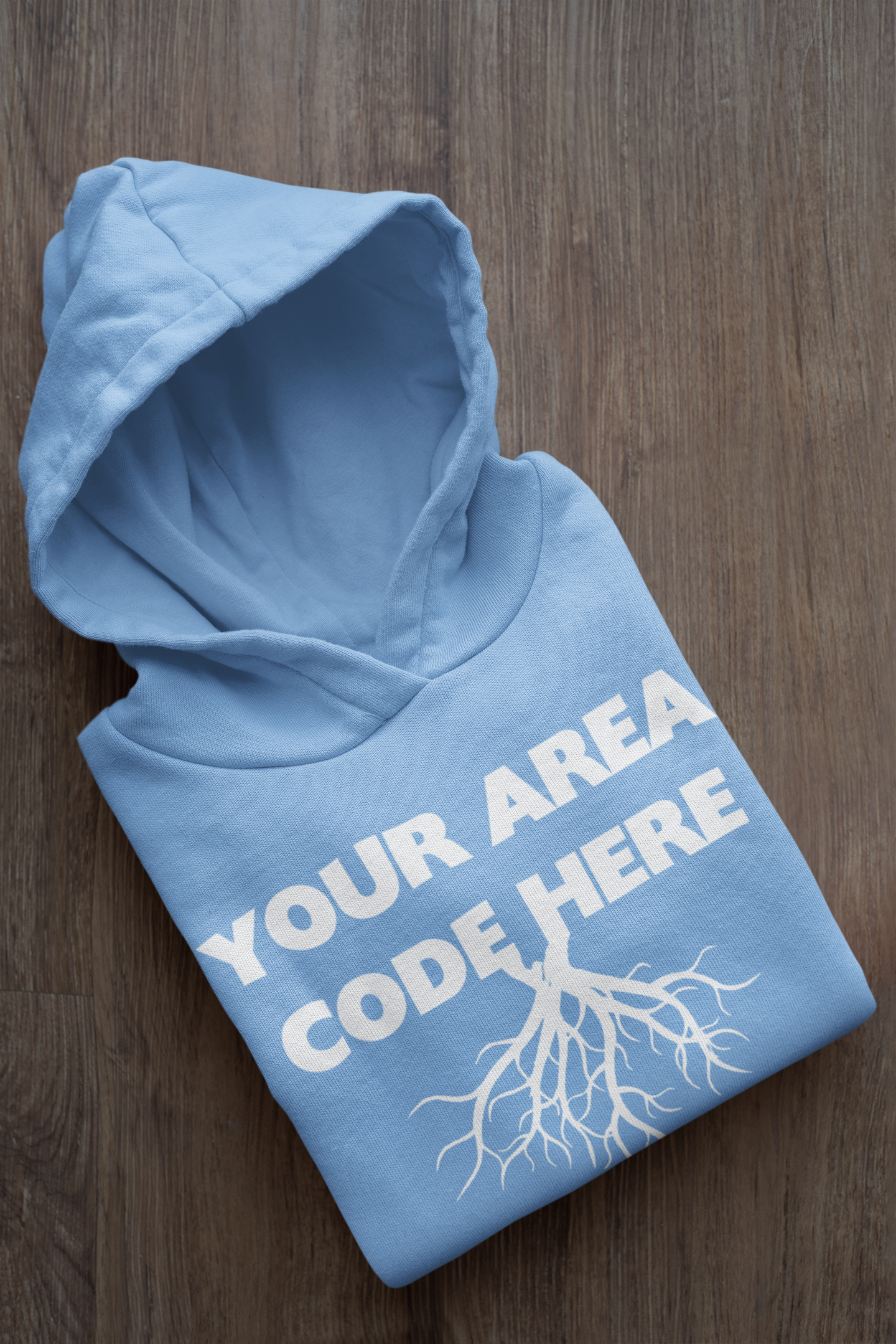 mockup-of-a-folded-customizable-hoodie-placed-on-a-wooden-surface-33874a.png