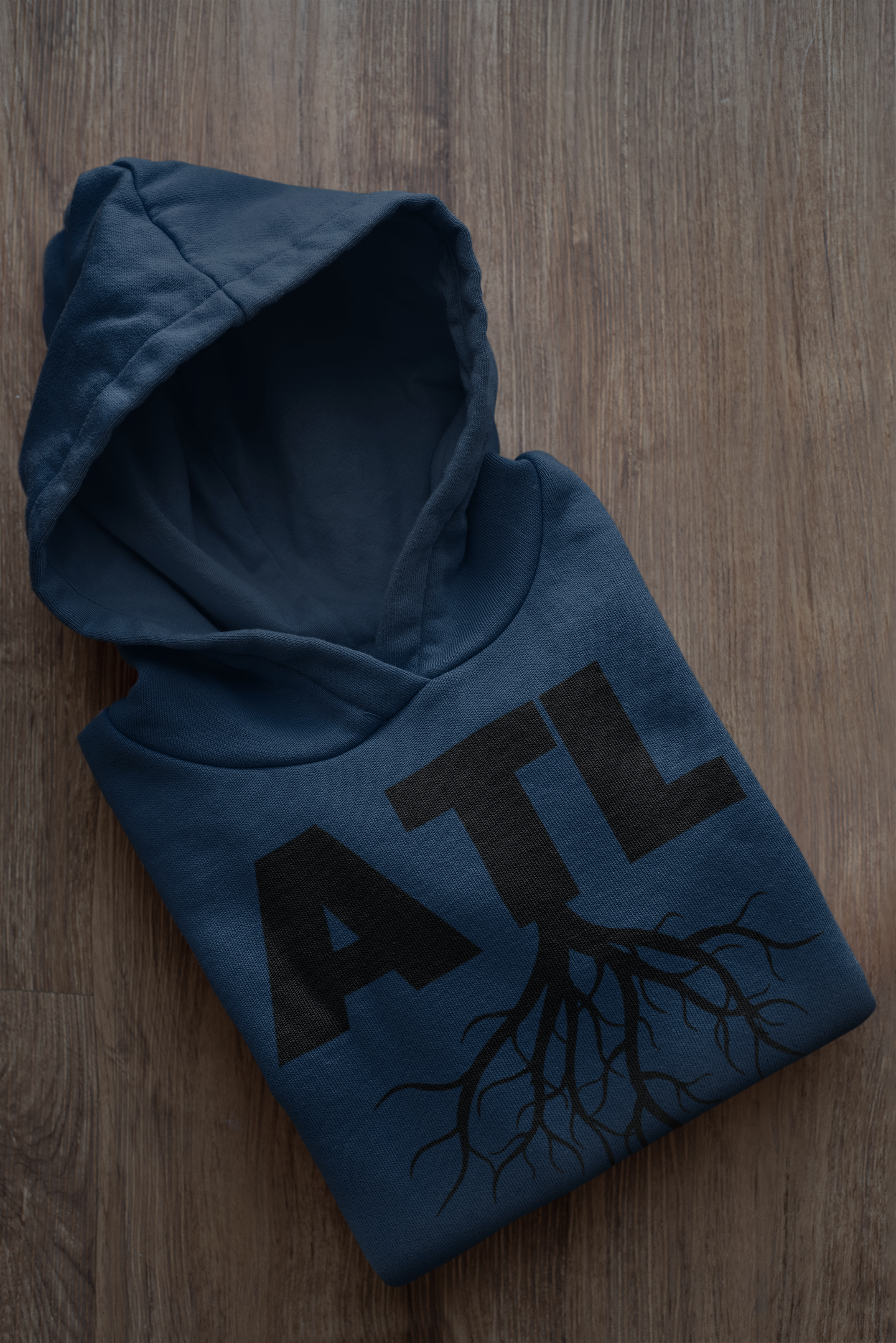 mockup-of-a-folded-customizable-hoodie-placed-on-a-wooden-surface-33874a.png