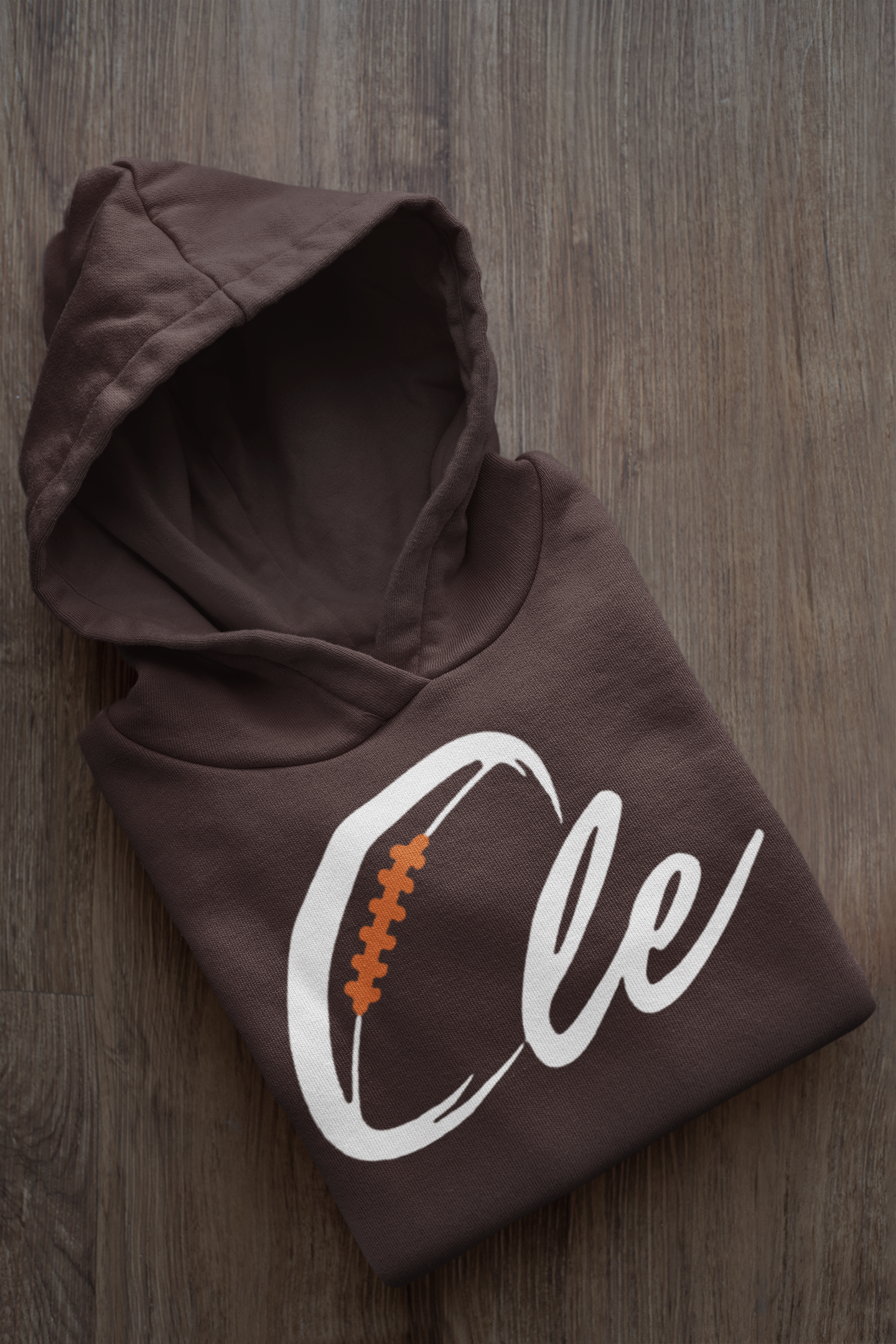 mockup-of-a-folded-customizable-hoodie-placed-on-a-wooden-surface-33874a (1).png