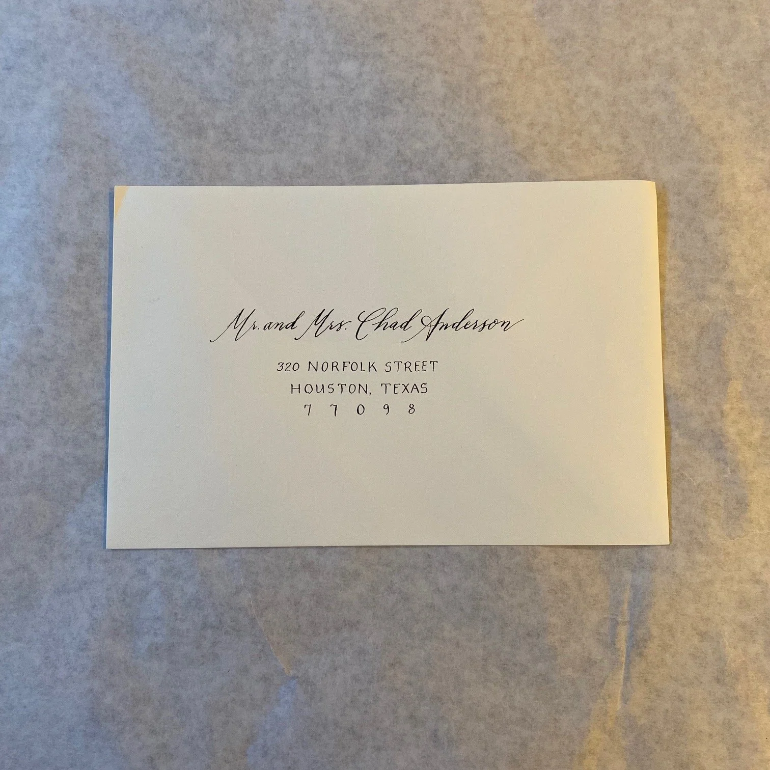 Modern script. Customized to match bride's invitation suite.
