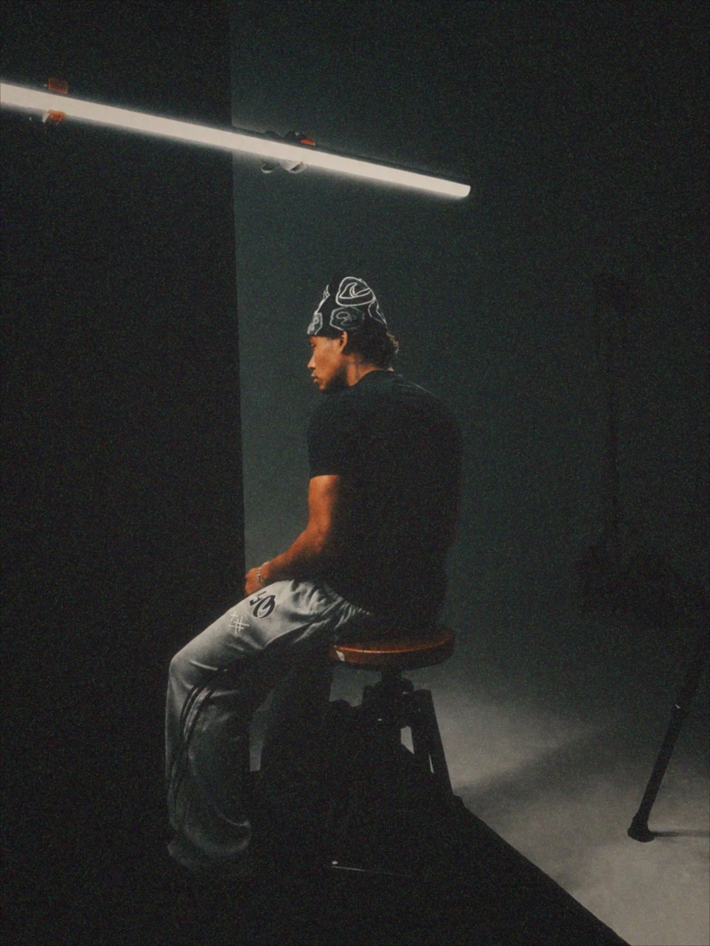 Athletic attractive muscular male wearing streetwear beanie pants and clothing