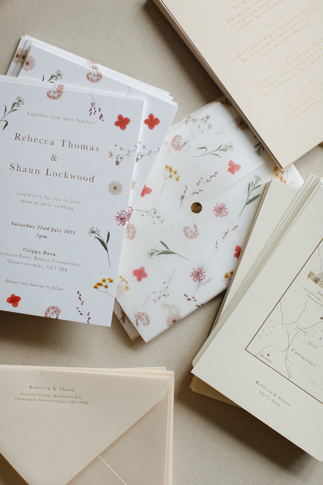 Floral wedding stationery designed with a colourful palette of pressed flowers