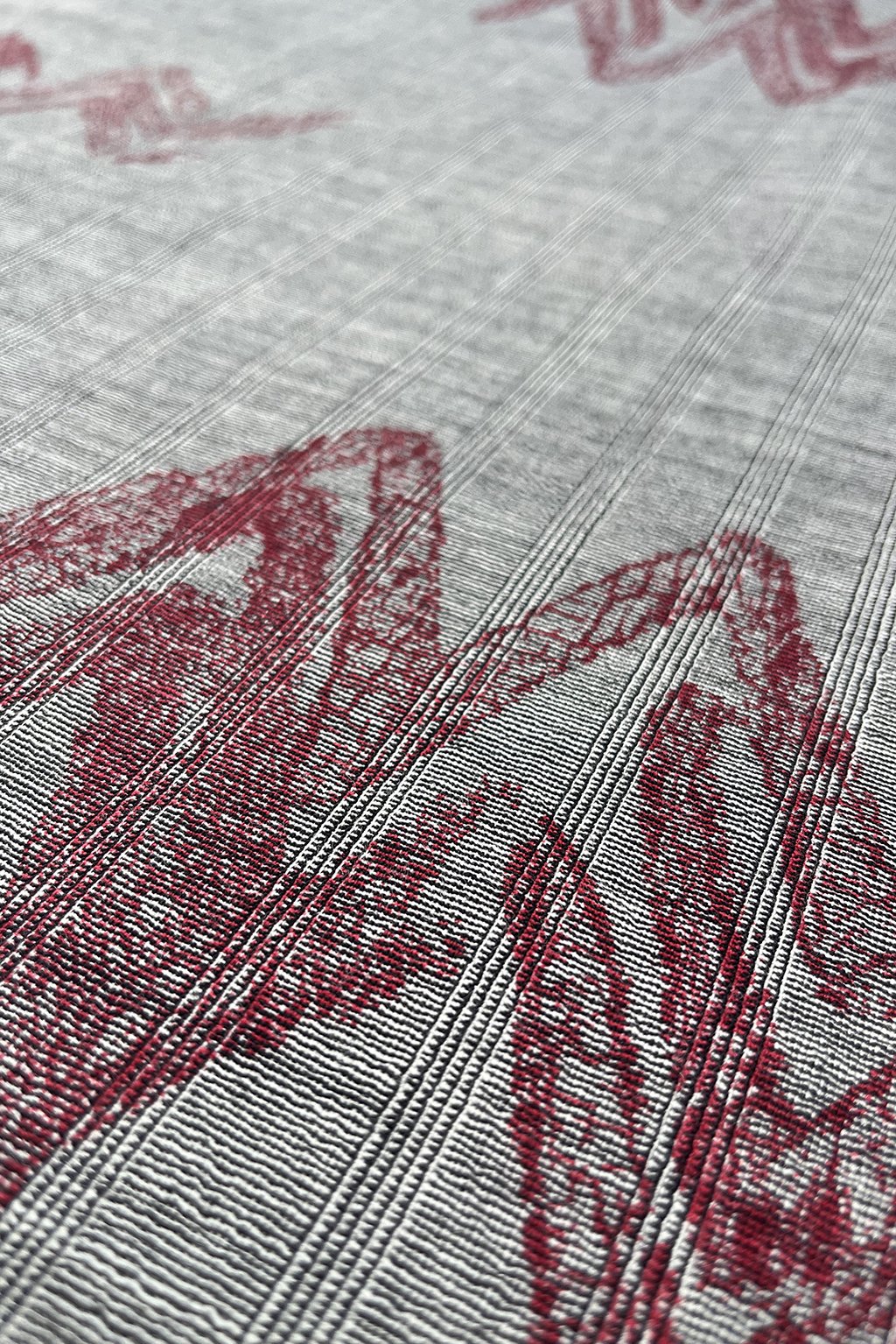Italian fine wool in micro stripe with an abstract overprint in burgundy1.jpg