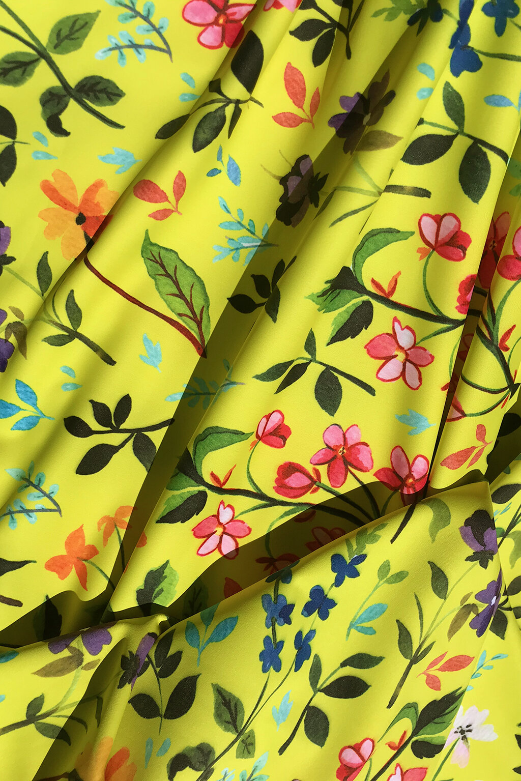 Swimwear fabric in lemon yellow with wildflowers - 50cm remnant