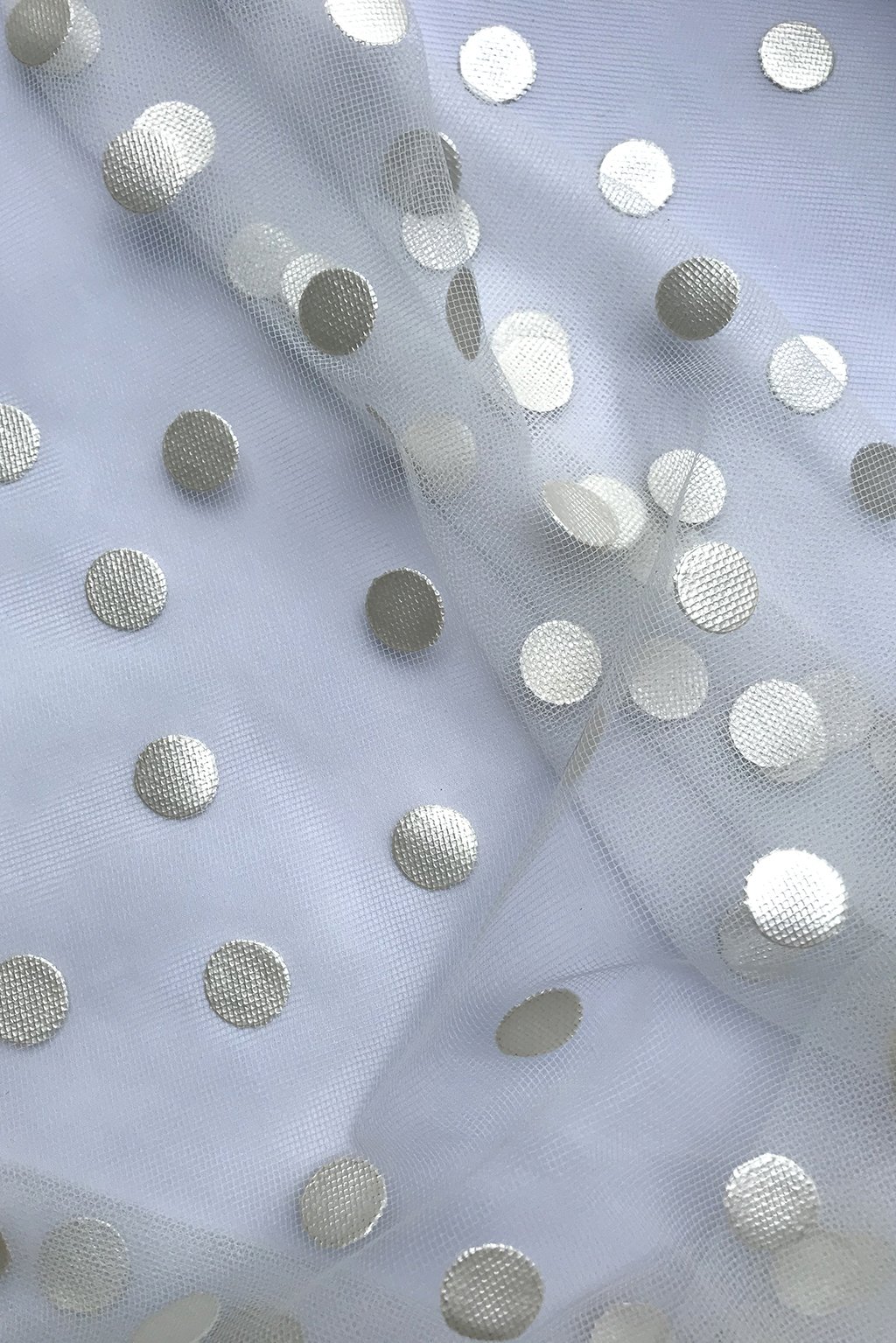 tulle in white with rubbery dots.jpg