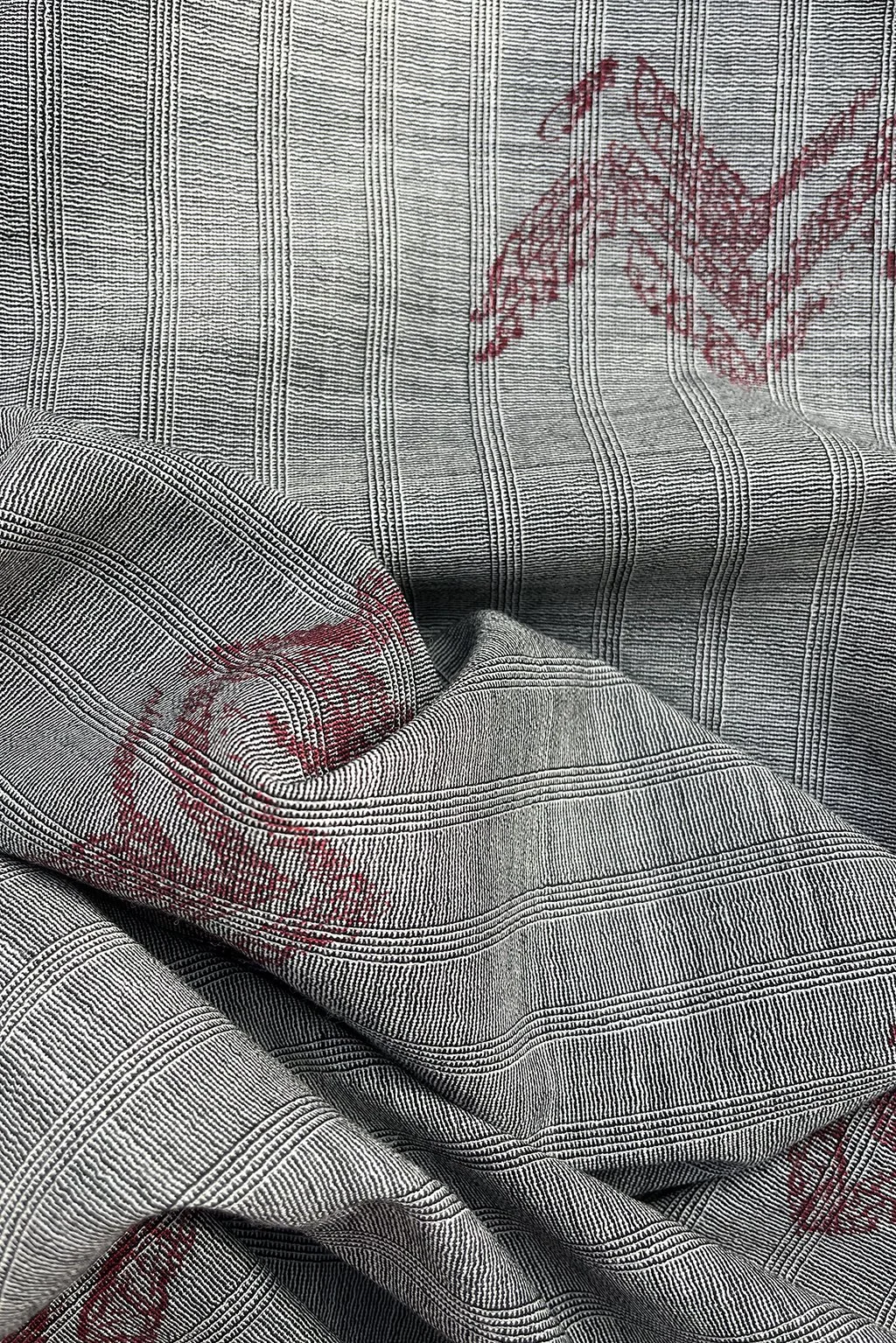 Italian fine wool in micro stripe with an abstract overprint in burgundy6.jpg