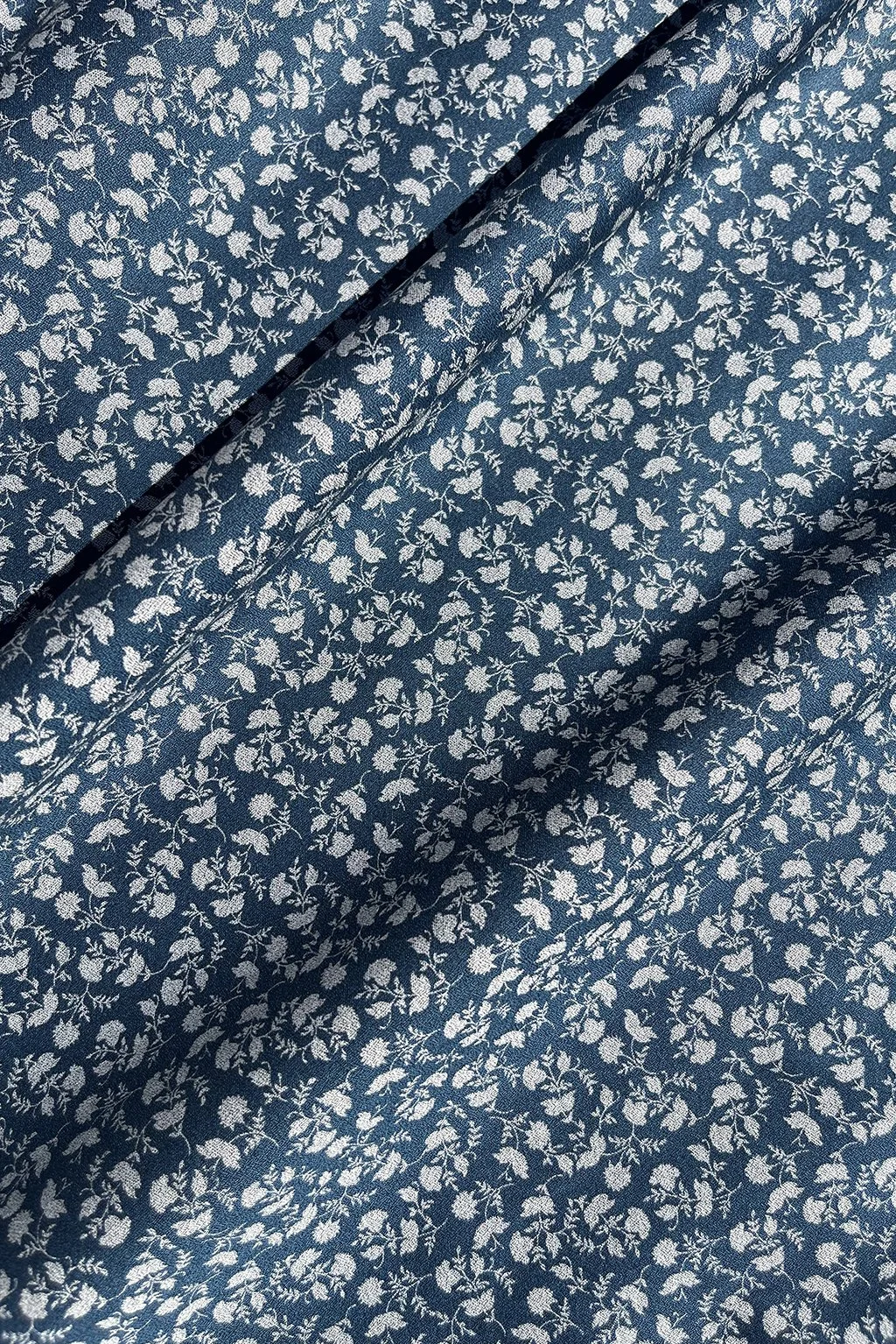 Italian cotton in ocean blue with small flowers.jpg