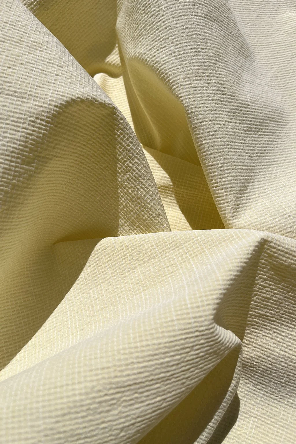 Cotton seersucker in daffodil yellow mini-check.jpg