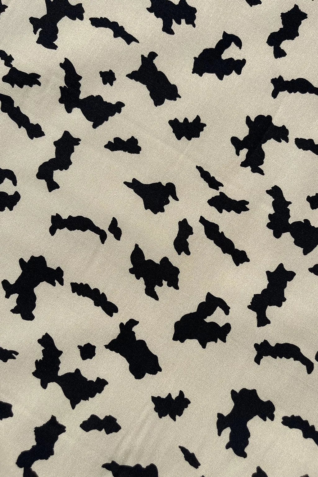 Cotton with an abstract print in beige and black2.jpg