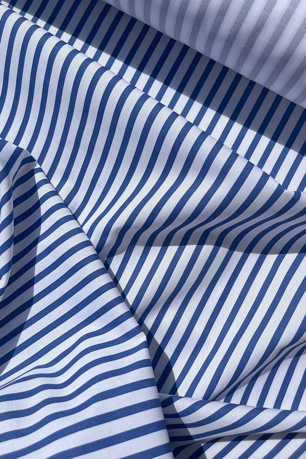Cotton shirting in white and ocean blue stripe e.jpg