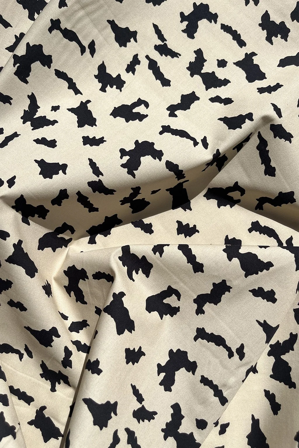 Cotton with an abstract print in beige and black.jpg