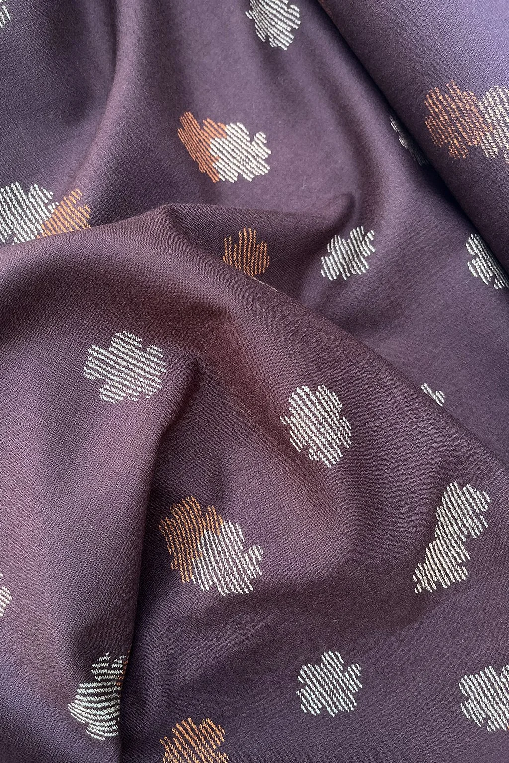 Italian superfine wool in chocolate with woven cherry blossom pattern