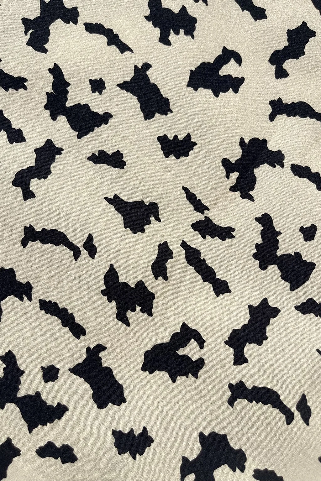Cotton with an abstract print in beige and black1.jpg