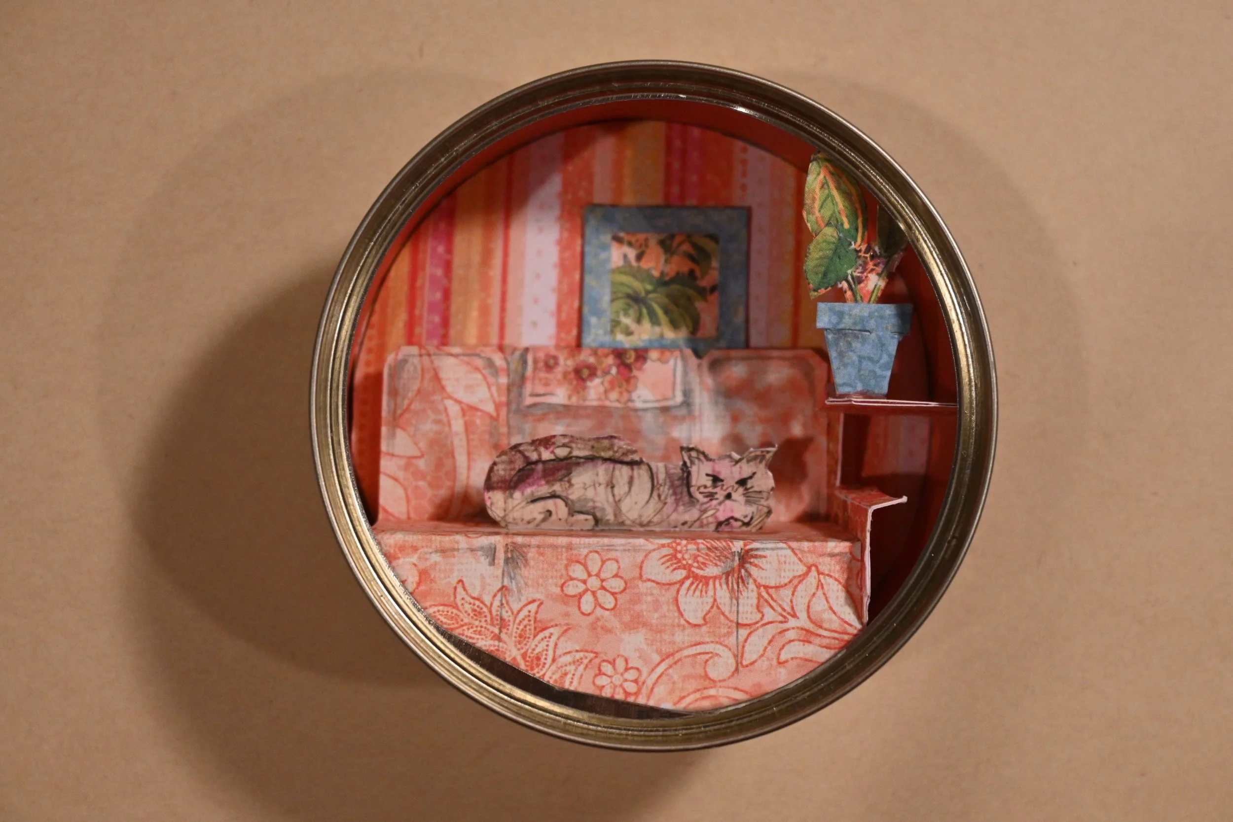 "Cat On An Orange Couch In A Tuna Can" (metal can, paper, graphite)