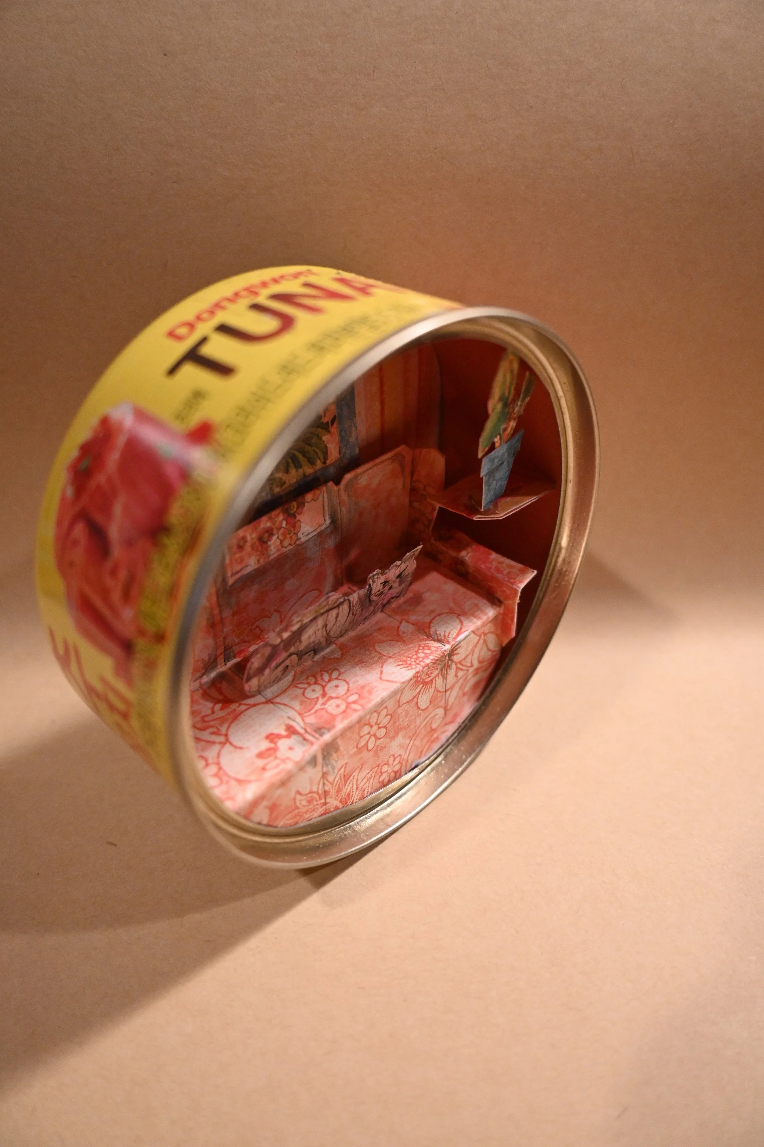 Cat On An Orange Couch In A Tuna Can-angle.JPG