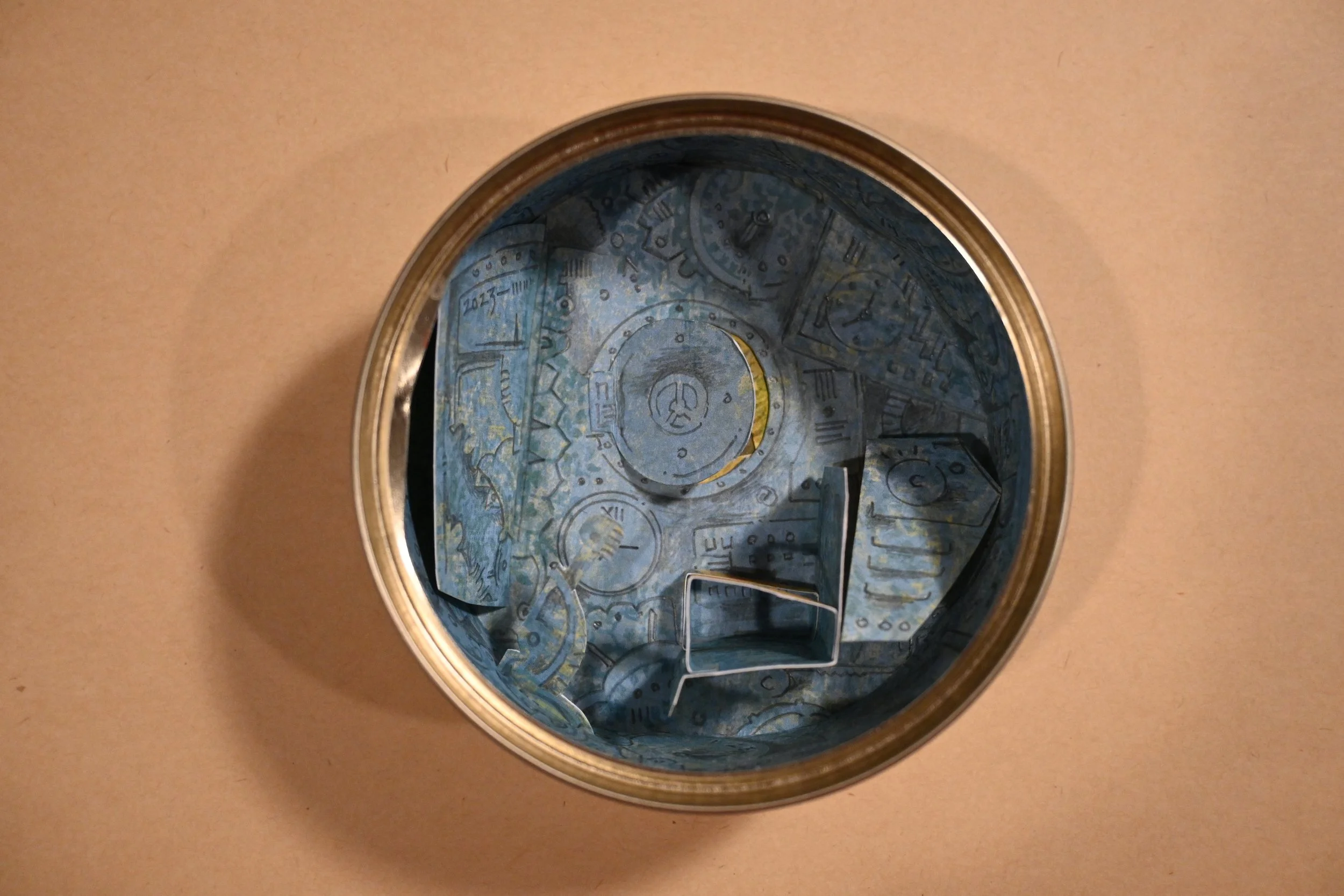 "Canned Time Machine" (metal can, paper, graphite, ink)