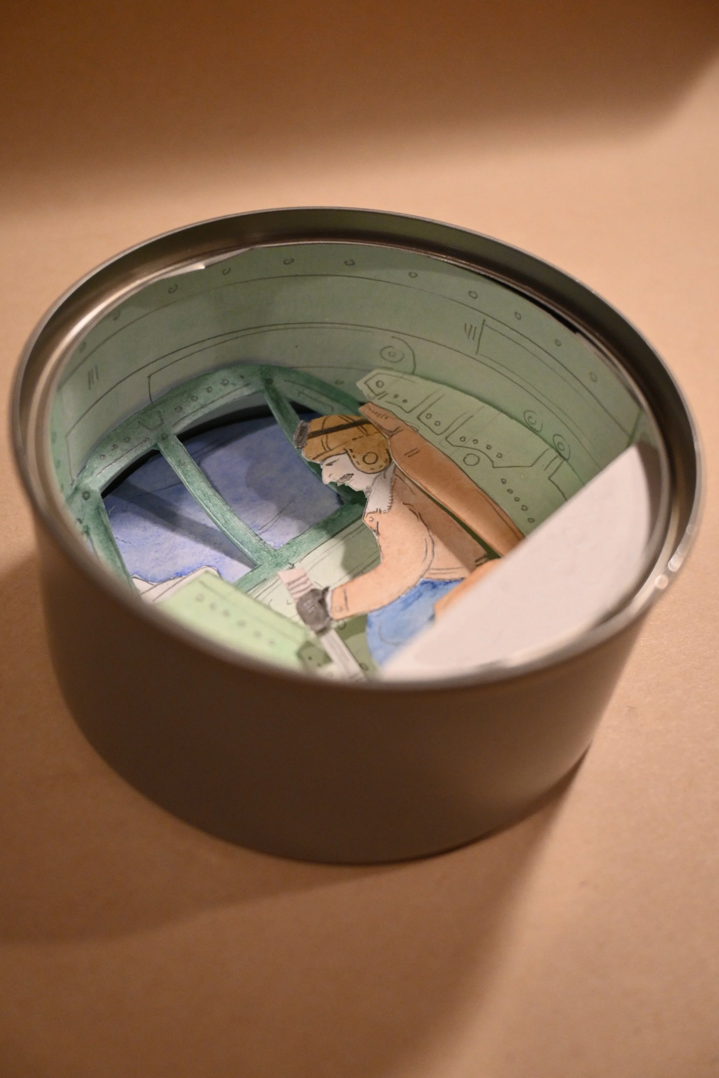 "Canned Spitfire" (metal can, paper, ink, watercolour, graphite)