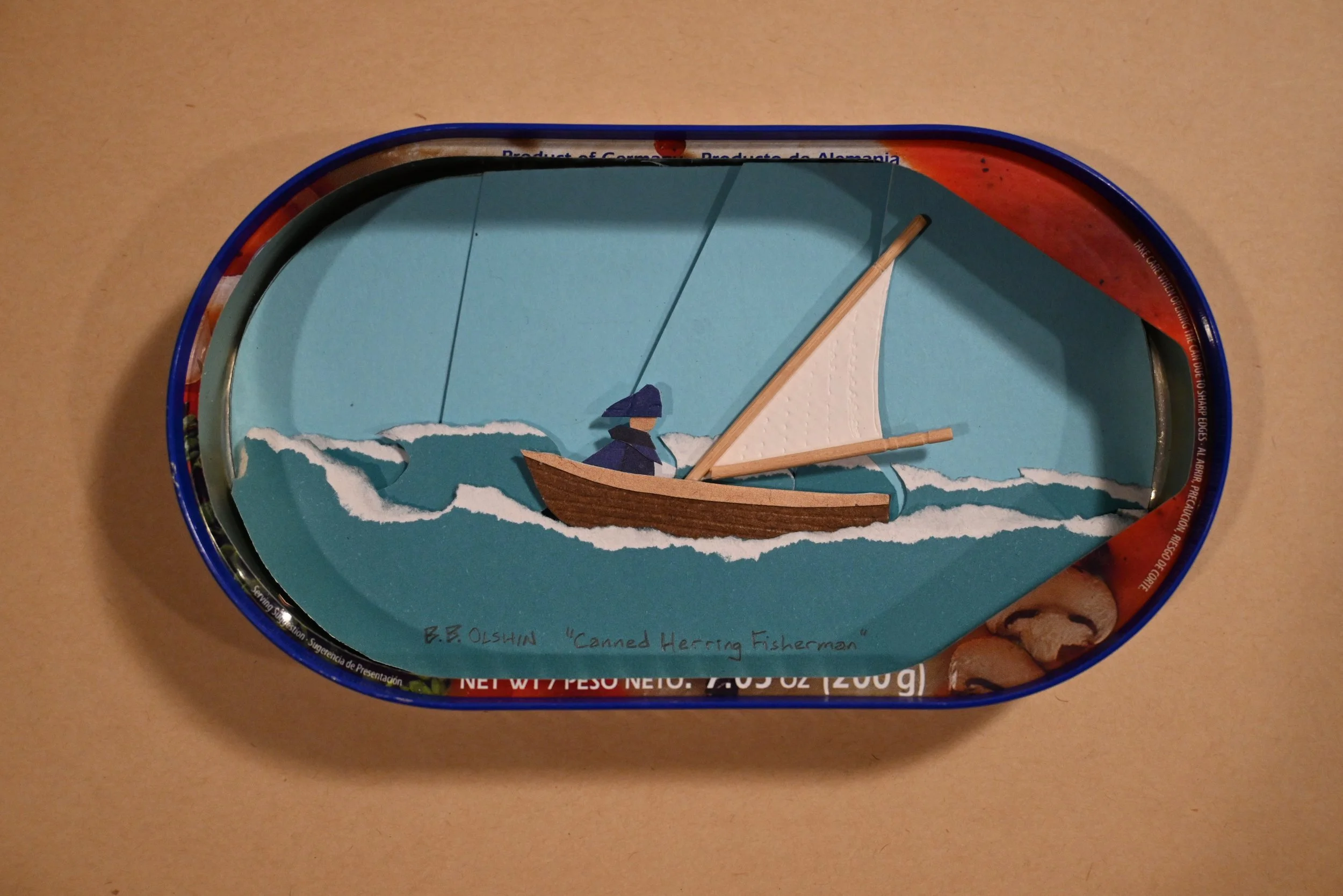 "Canned Herring Fisherman" (metal can, paper, wood)