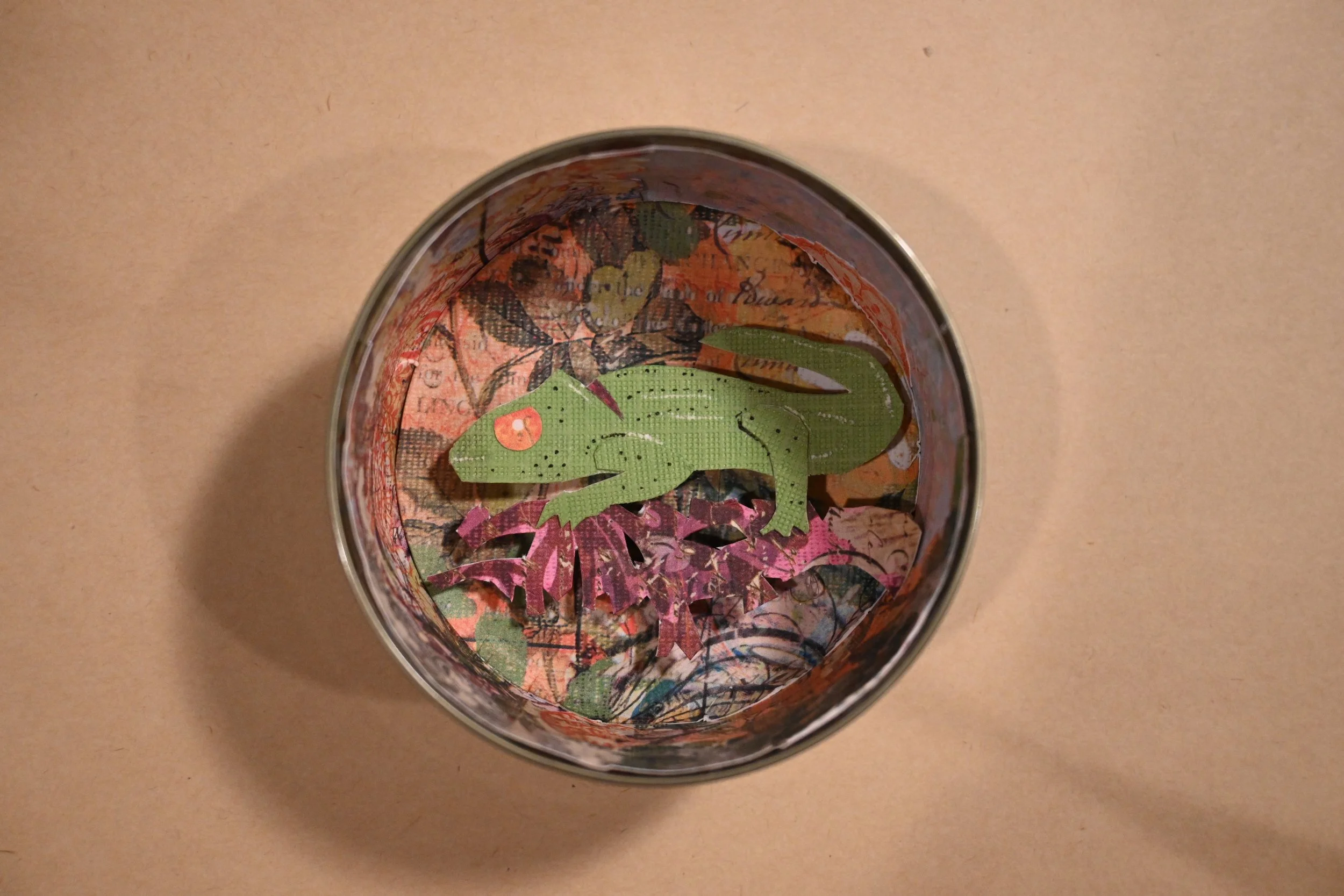 "Chameleon In A Can" (metal can, paper, graphite, ink)